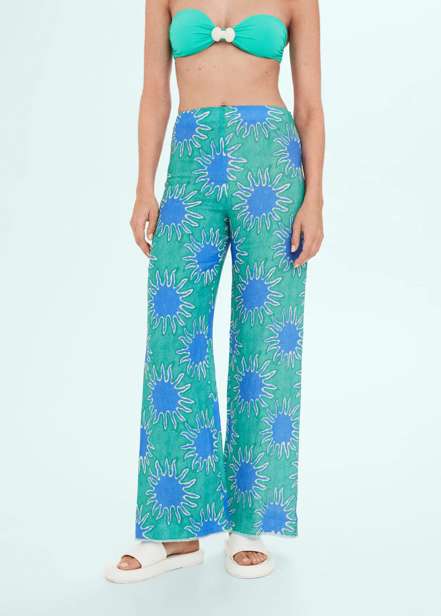 Mango Printed linen wideleg pants. a woman wearing a pair of green and blue pants. 