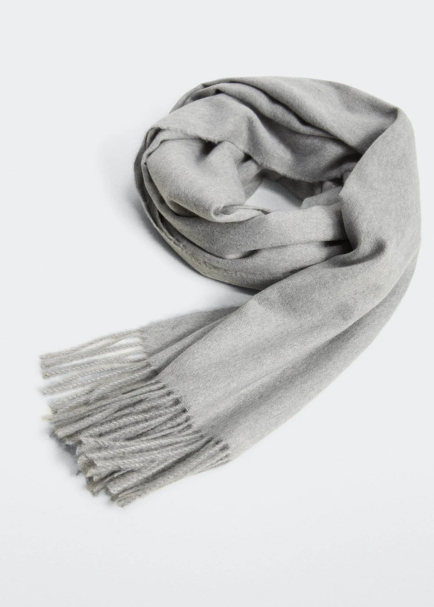 Mango Fringed edge scarf. a gray scarf is laying on a white surface. 