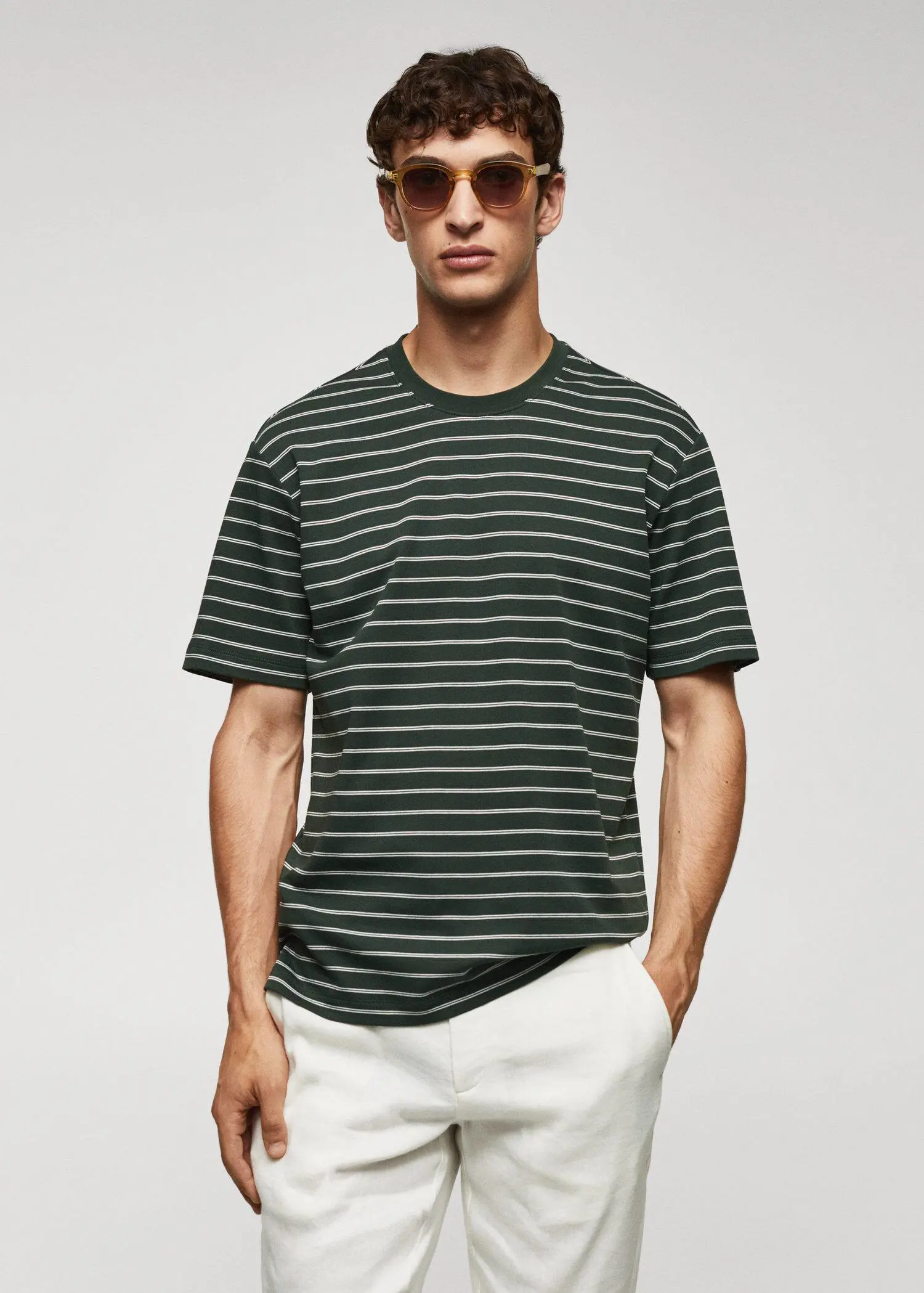 Mango Striped 100% cotton t-shirt. a man wearing a striped shirt and sunglasses. 