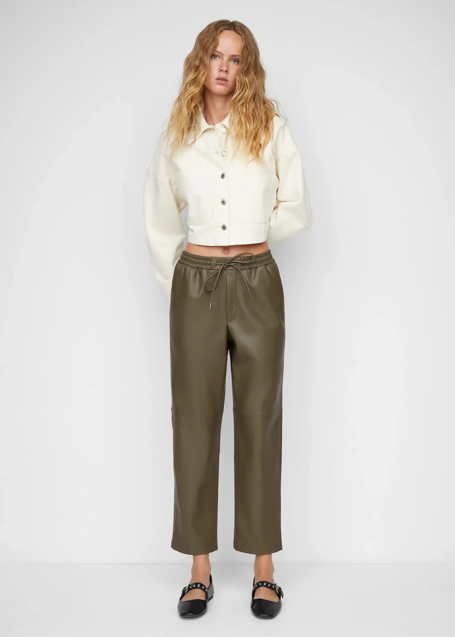 Mango Leather-effect elastic waist trousers. 1