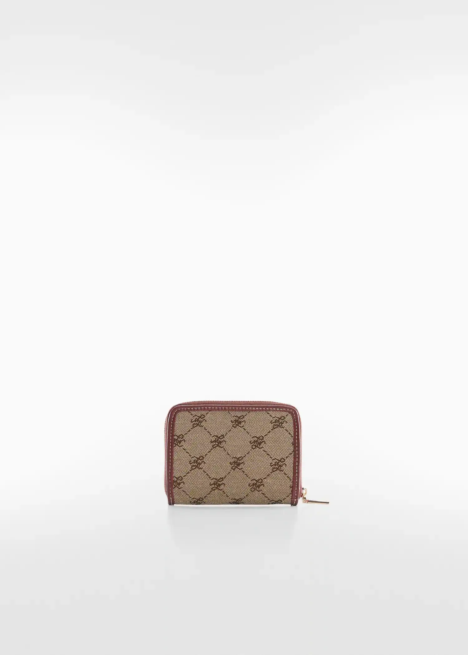 Mango Jacquard wallet. a brown and red wallet on top of a white table. 