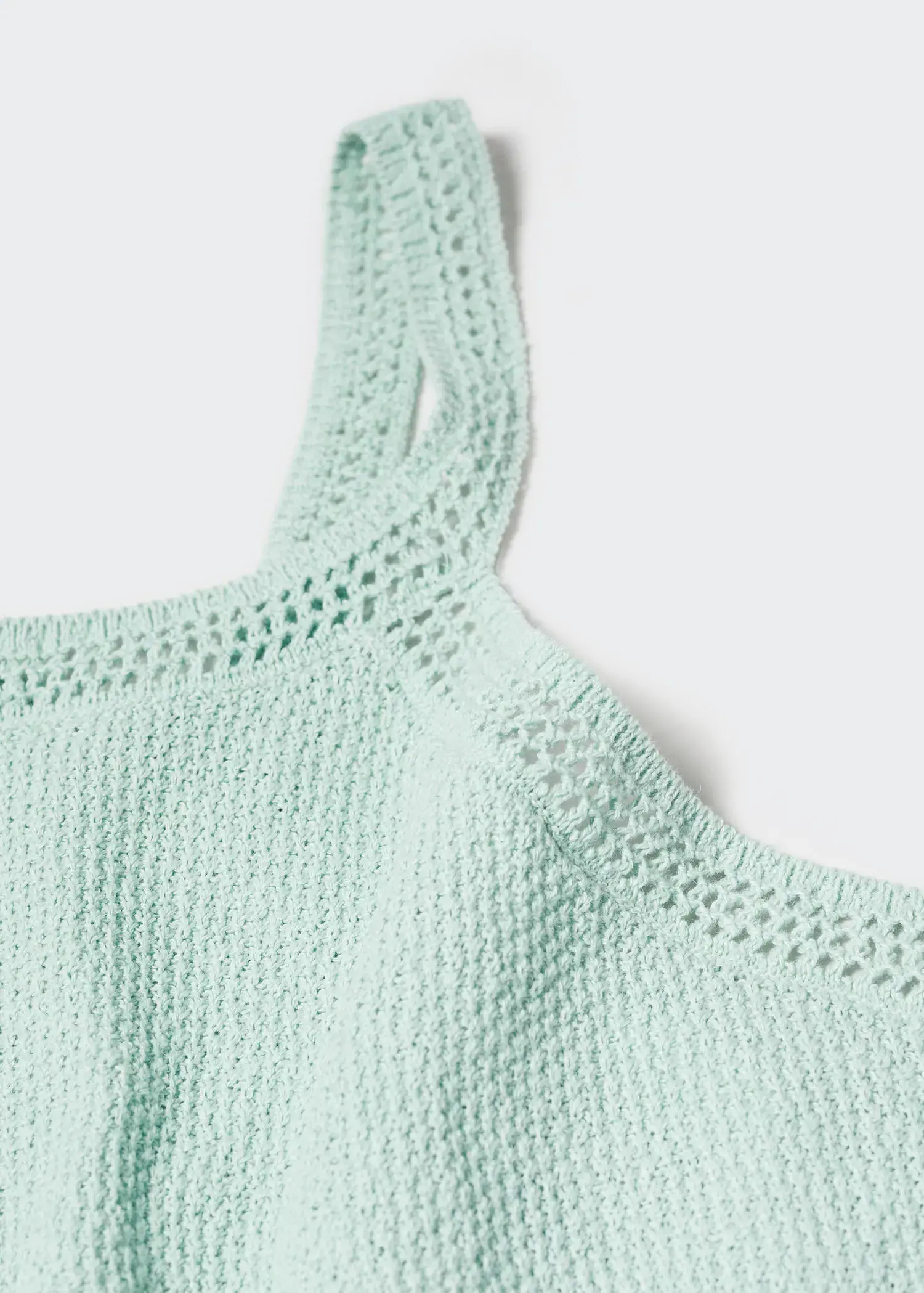 Mango Crochet top. a close-up view of a light blue top. 