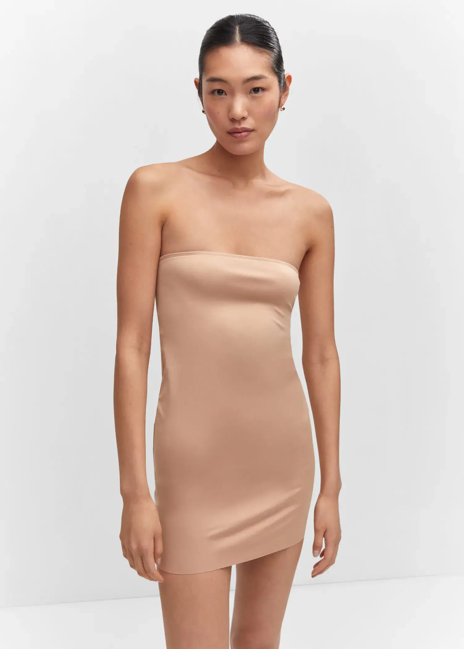 Mango Seamless strapless dress. a woman in a tan dress posing for a picture. 
