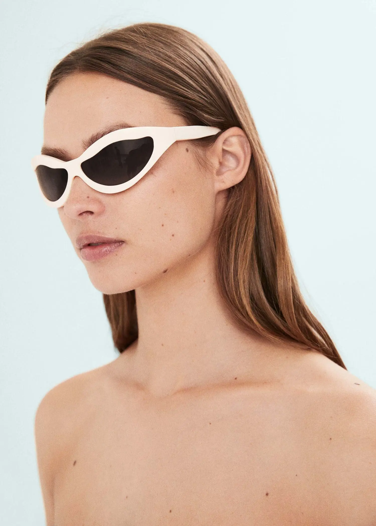 Mango Irregular crystals sunglasses. a woman with long brown hair wearing sunglasses. 