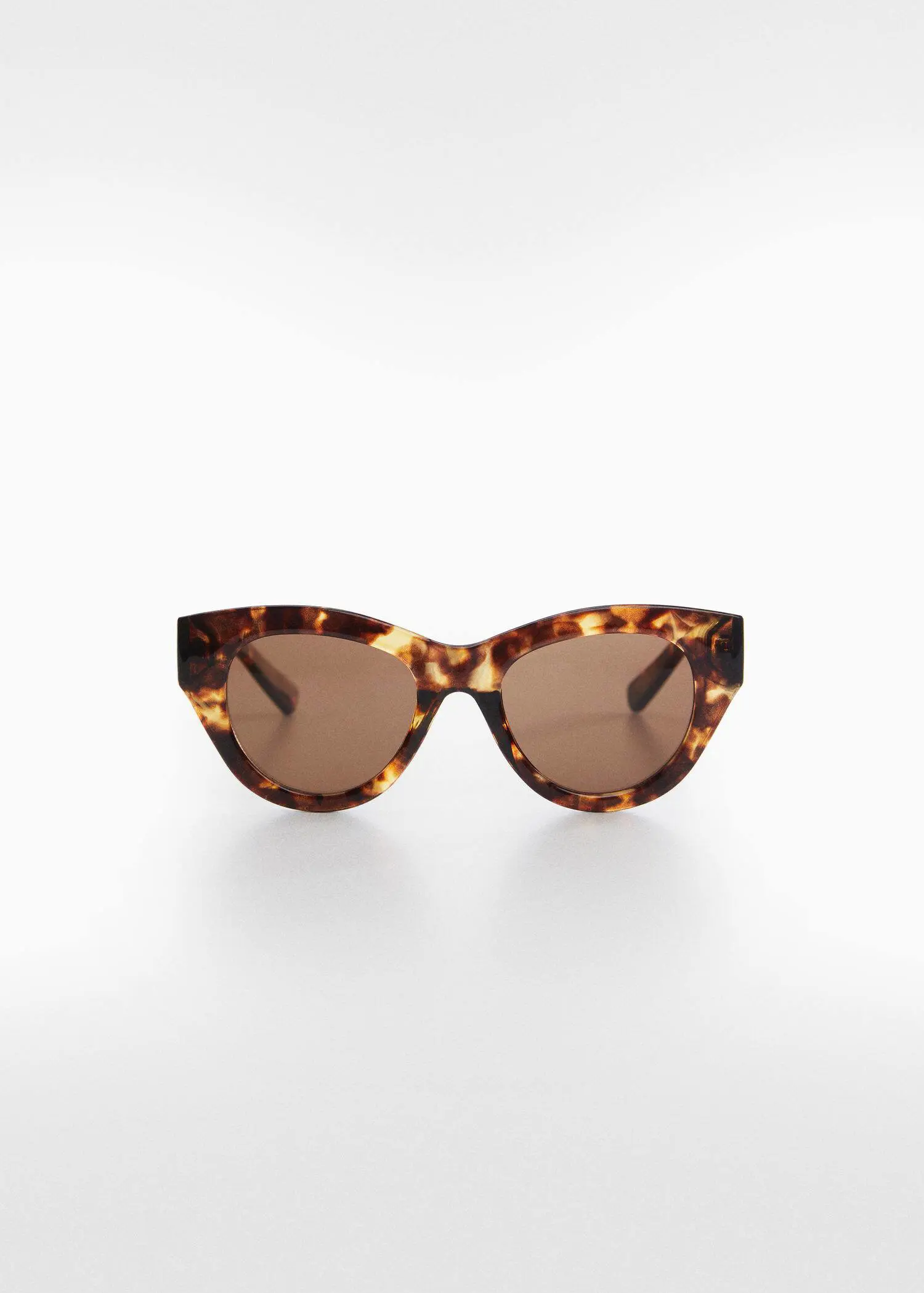 Mango Rounded sunglasses. a pair of brown sunglasses sitting on top of a white table. 