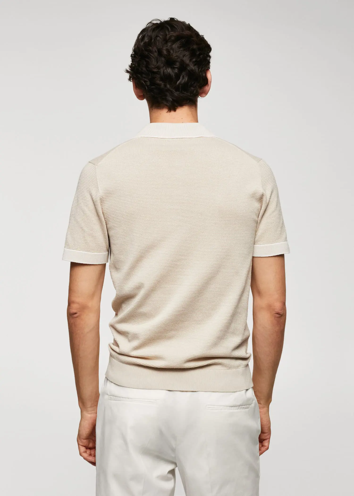 Mango Fine-knit polo shirt with zipper. a man wearing a white shirt and a beige shirt. 