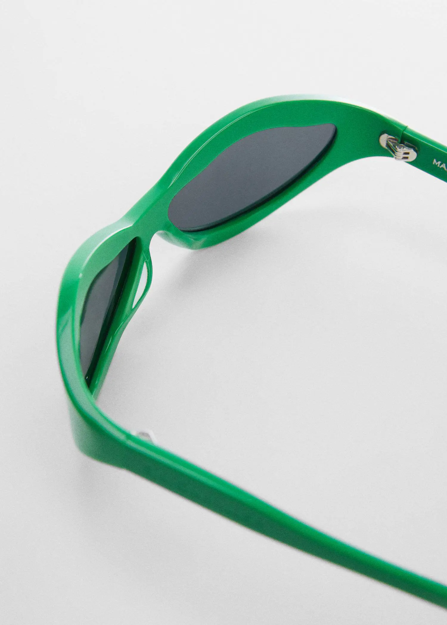 Mango Irregular crystals sunglasses. a close up of a pair of green sunglasses 