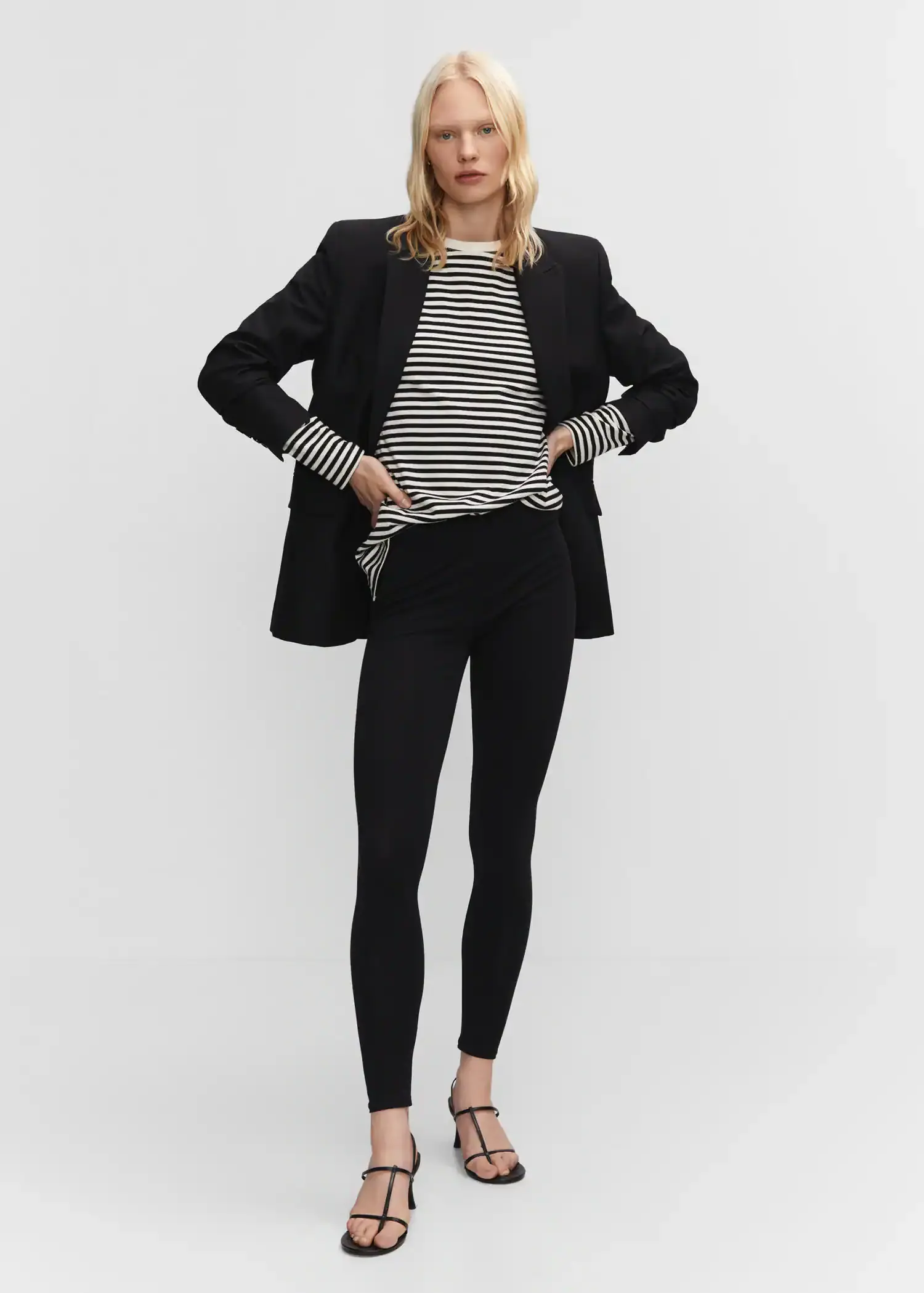 Mango High waist cotton leggings. a woman in a black and white striped shirt and jacket 