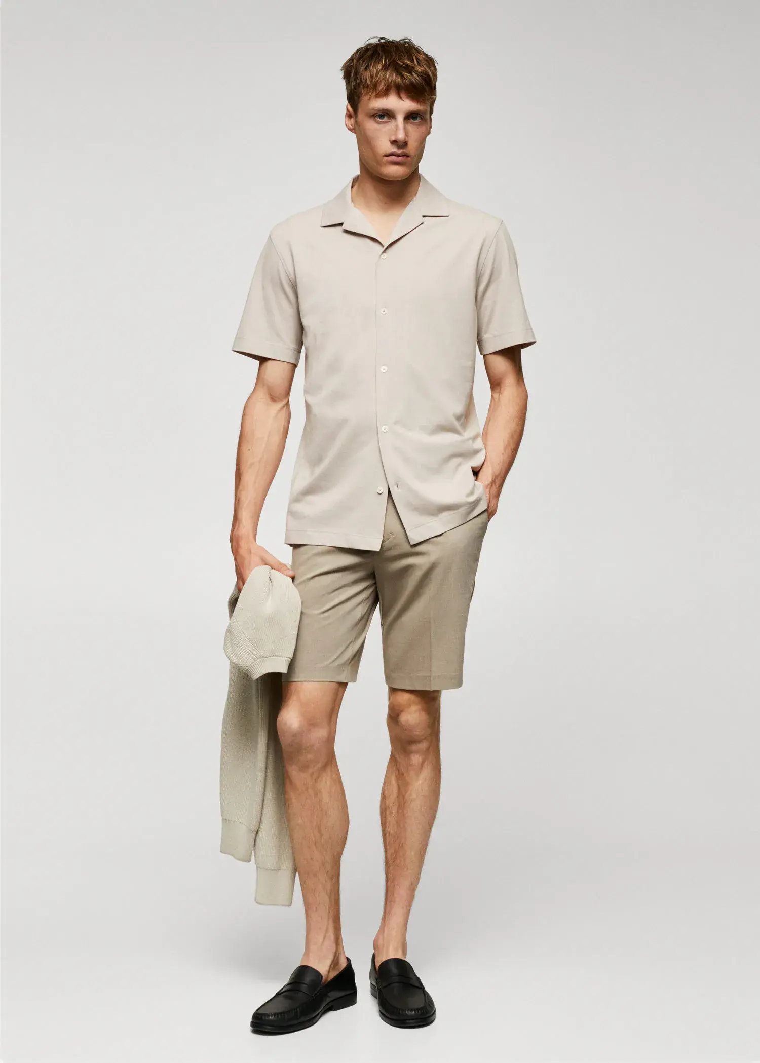 Mango Bowling-collar pique shirt. a man in a tan shirt and tan shorts. 