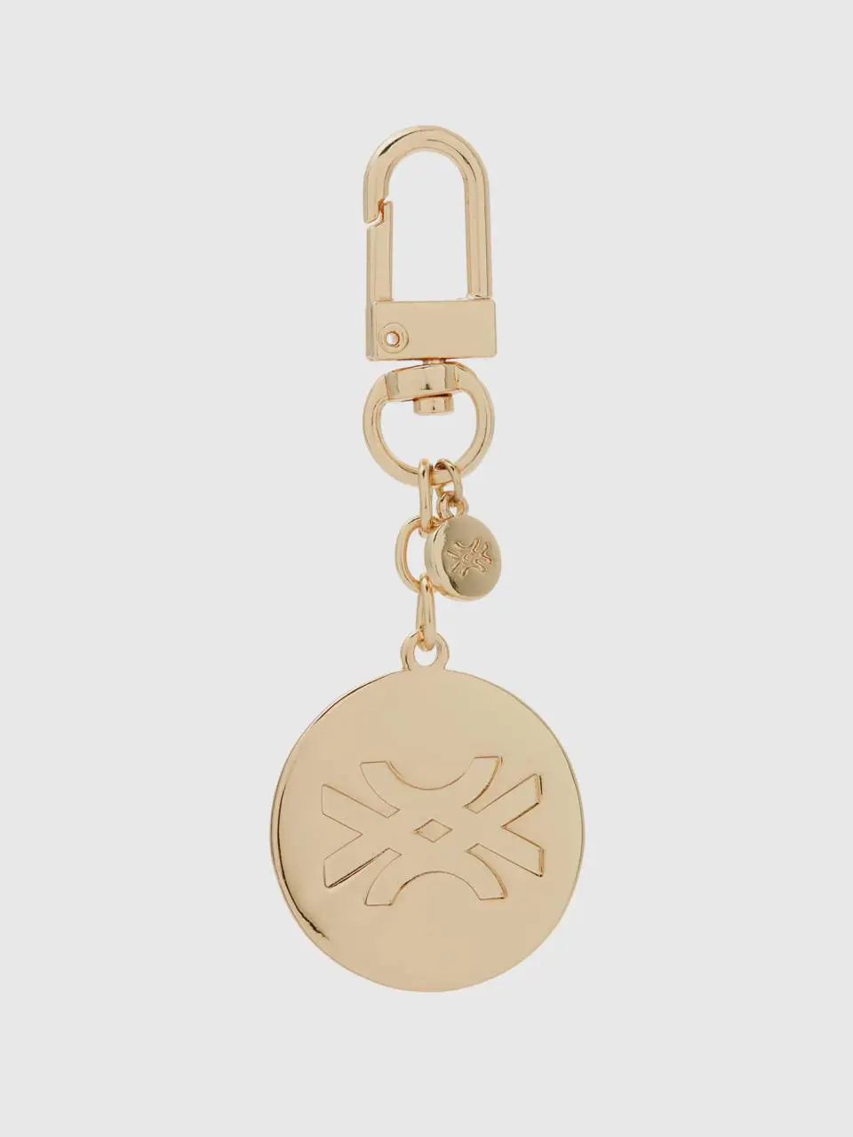 Benetton gold keychain with pendant. 1