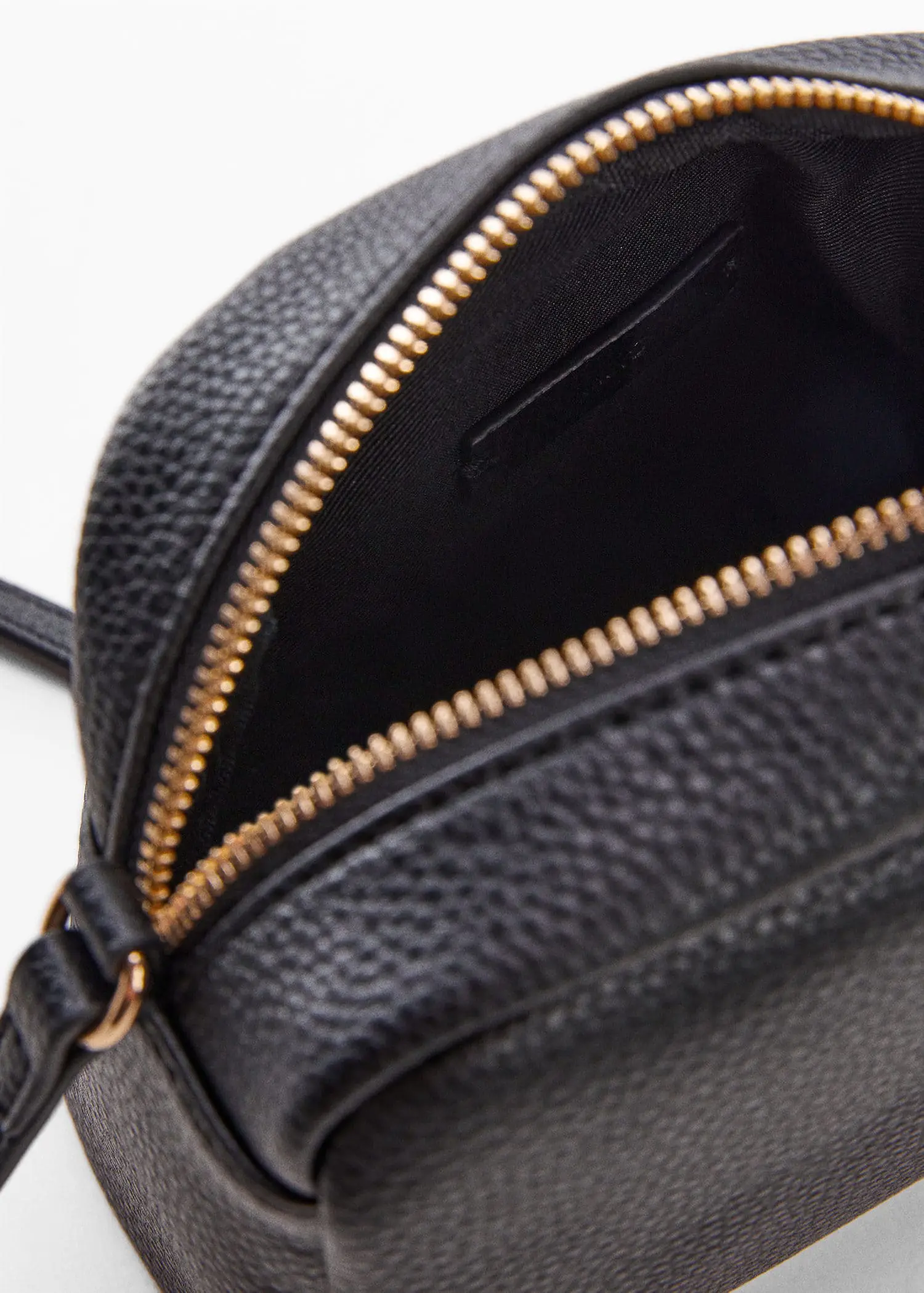 Mango Crossbody bag with chain. a close-up view of the inside of a black purse. 