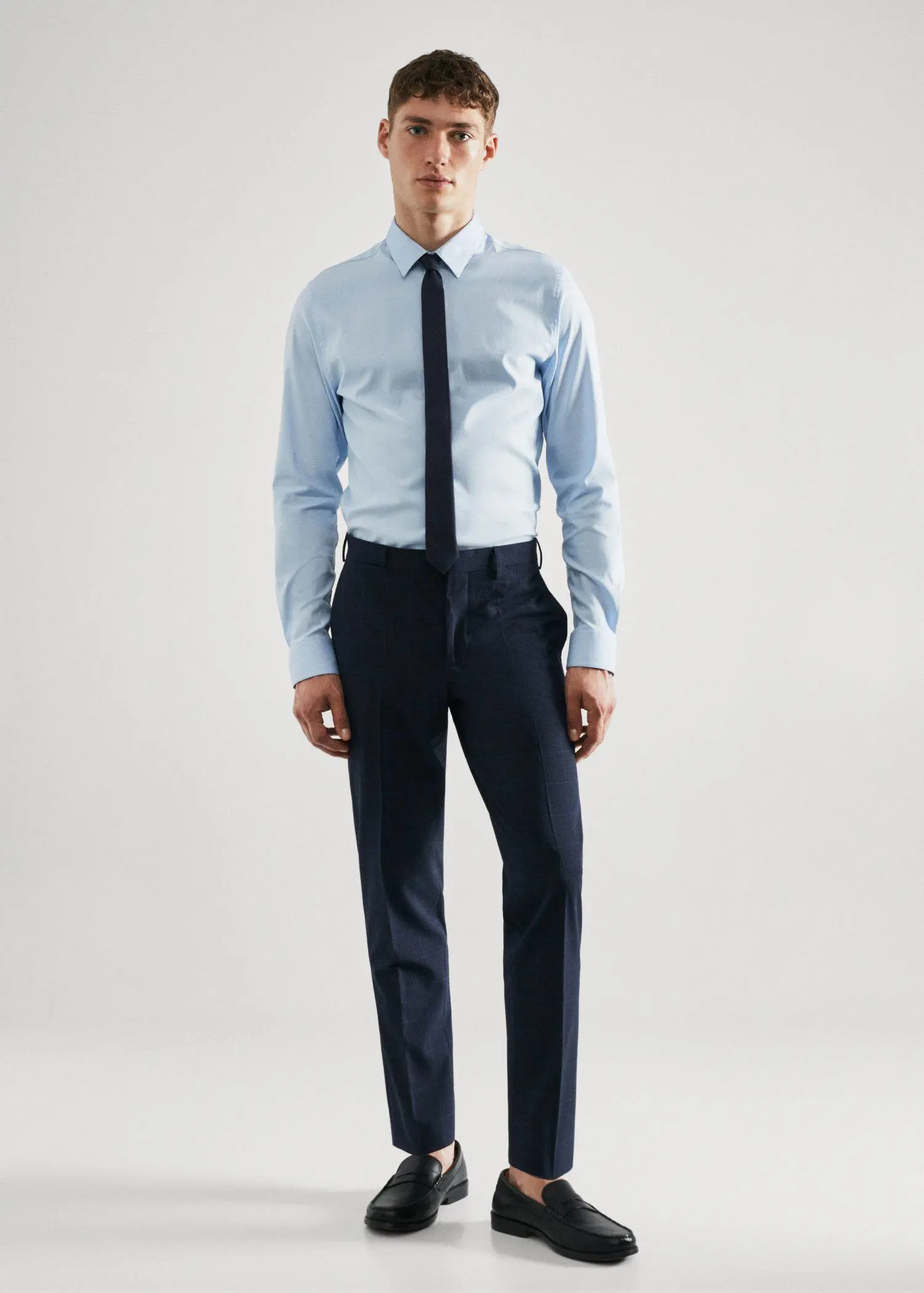 Mango Super slim-fit Tailored check trousers. a man in a dress shirt and tie. 