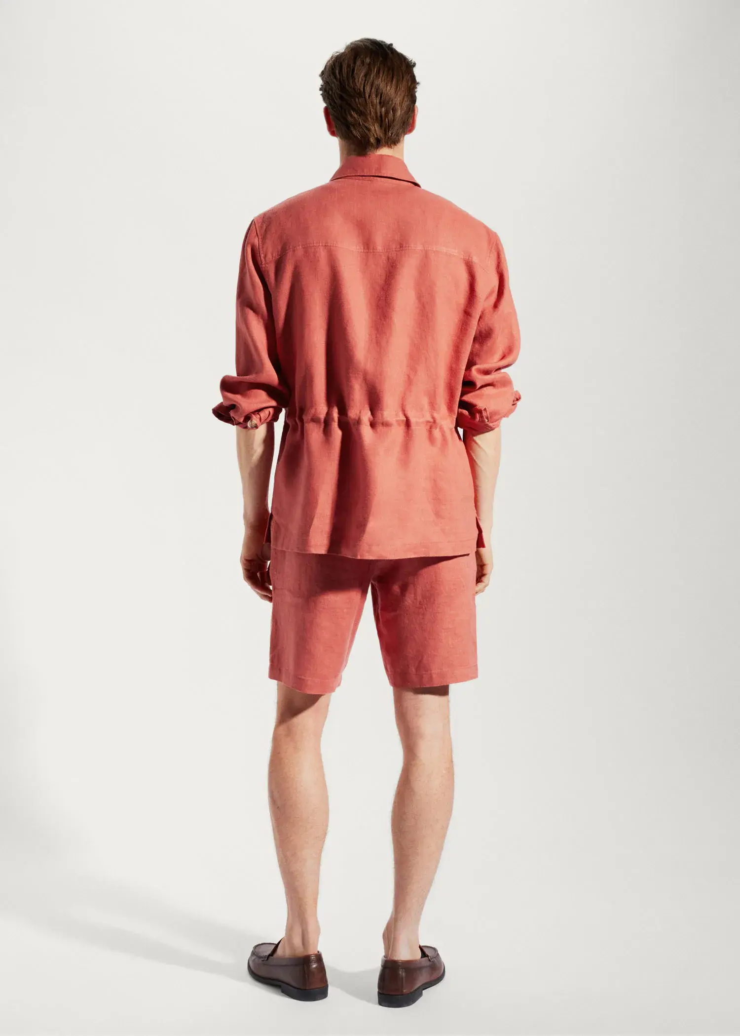 Mango 100% linen regular-fit overshirt. a man wearing a red jacket and shorts. 