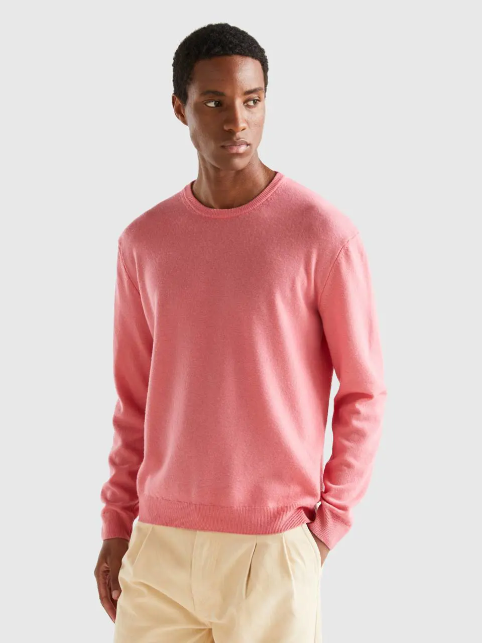 Benetton salmon pink crew neck sweater in pure merino wool. 1