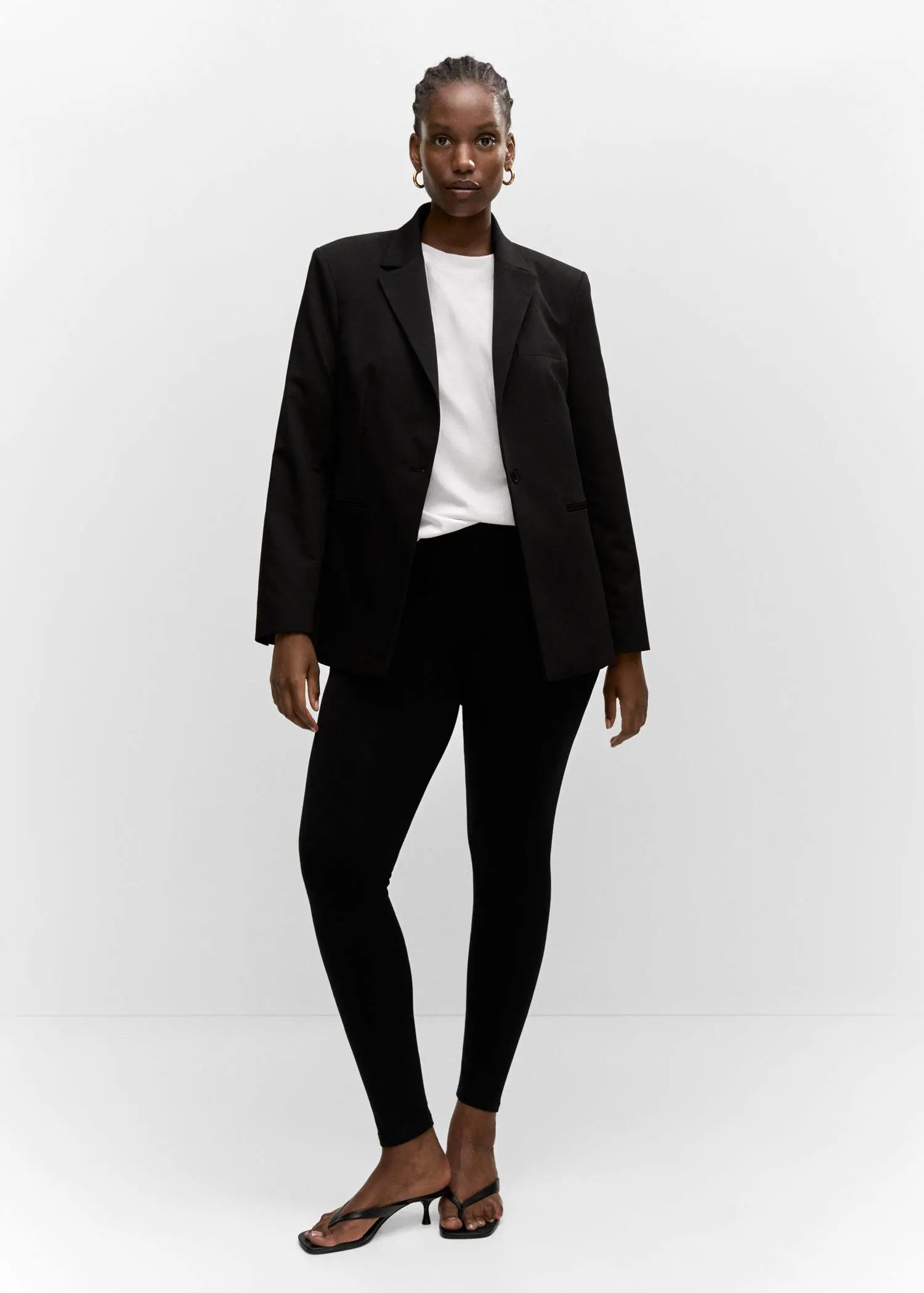 Mango High waist cotton leggings. a woman wearing a black jacket and black pants. 