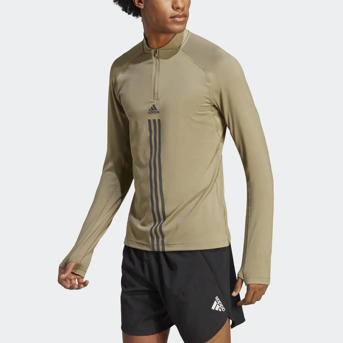 Adidas AlphaStrength 1/4 Zip Long Sleeve Top. 1