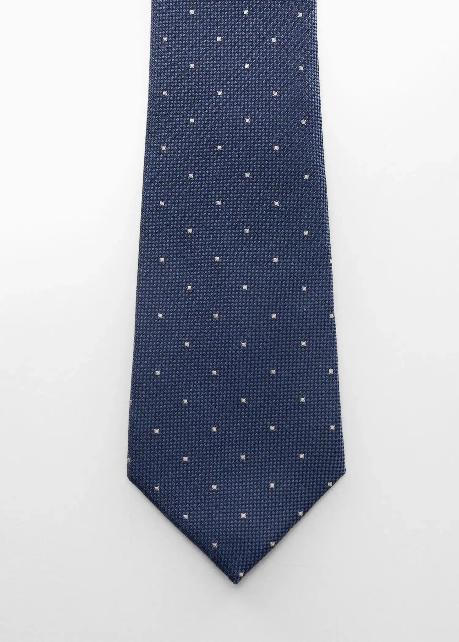 Mango Tie with micro polka-dot structure. a blue tie with white polka dots on it. 
