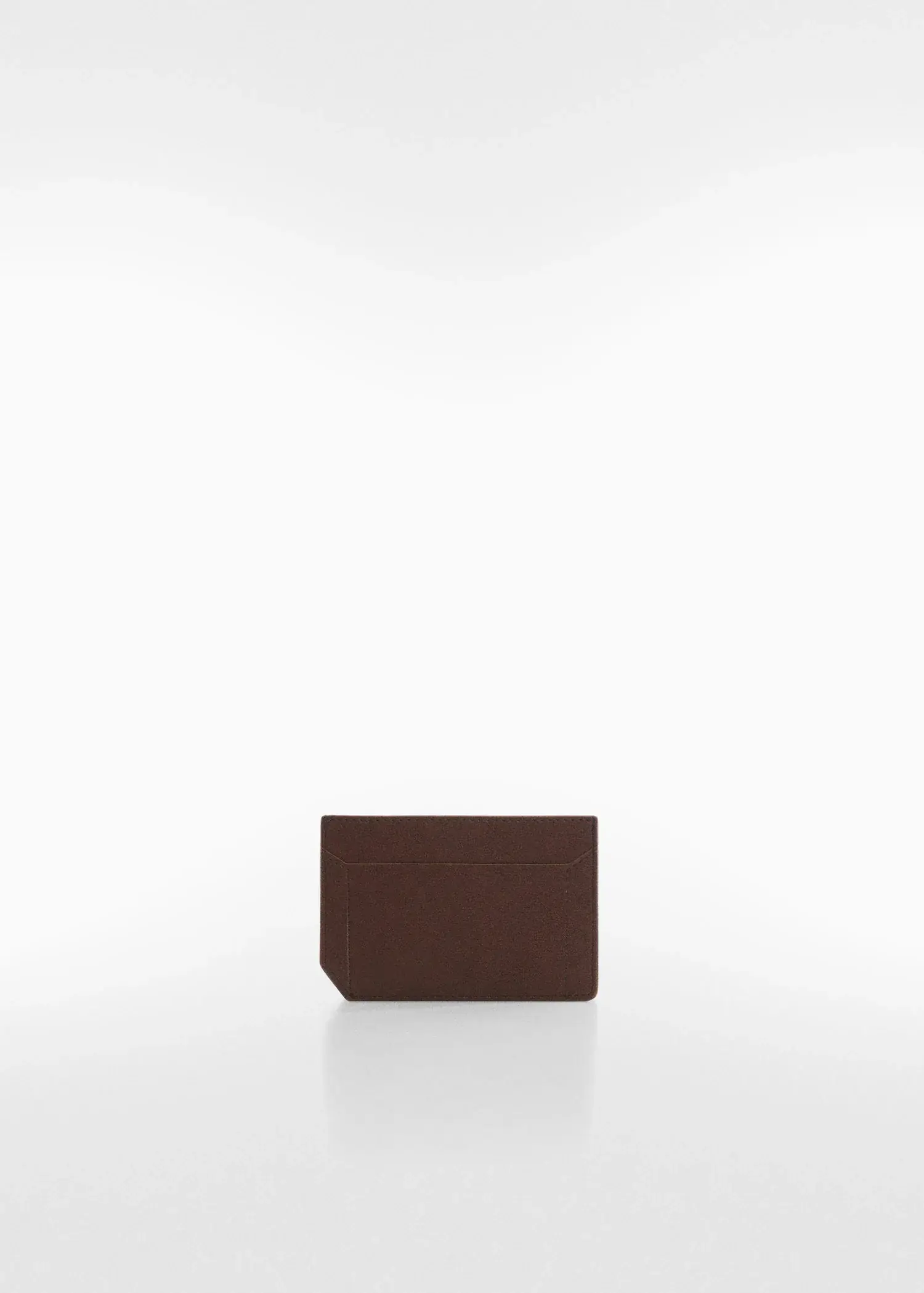Mango Anti-contactless leather-effect card holder. a piece of brown leather sitting on top of a table. 