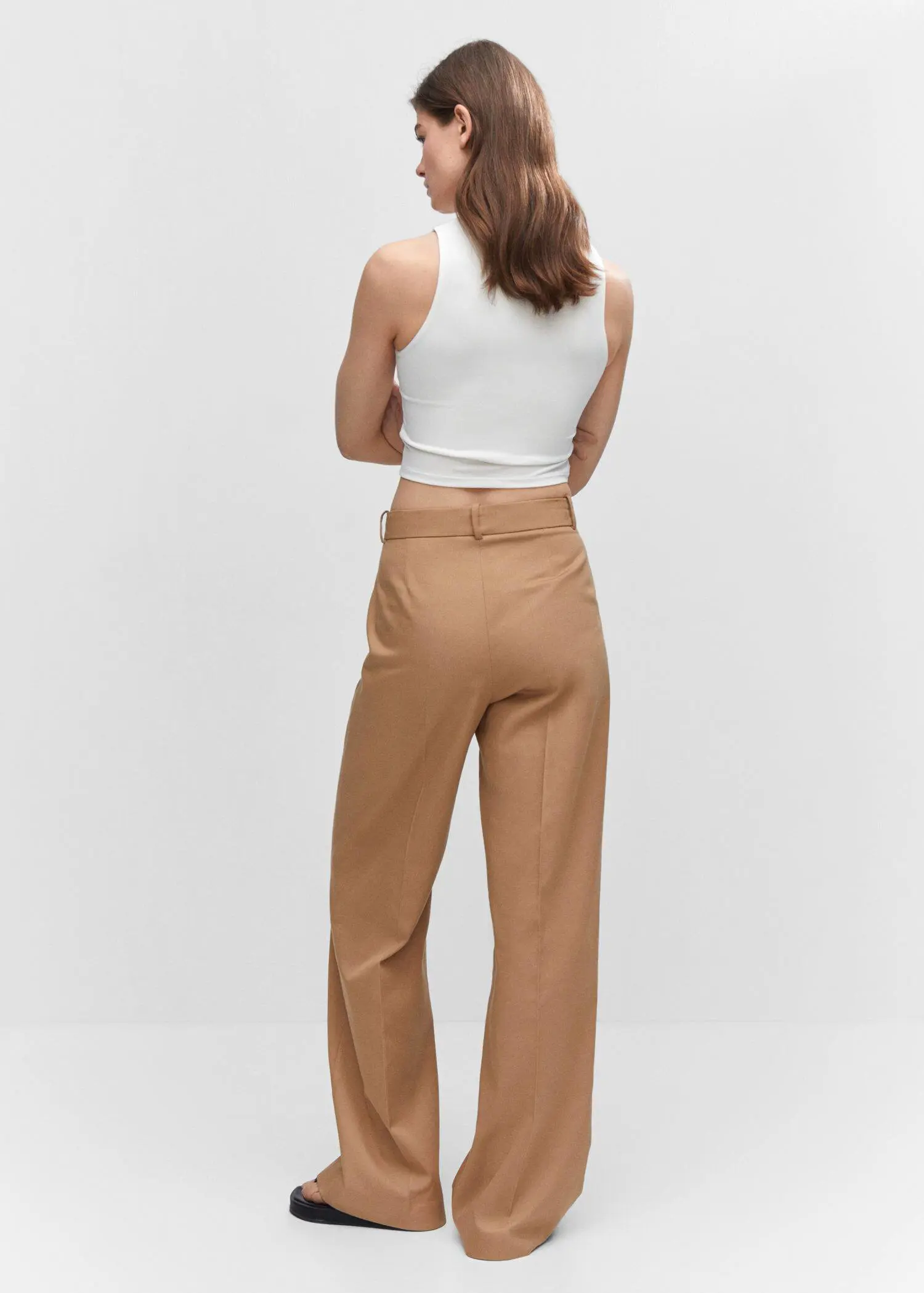 Mango Crop top with halter neck. a woman wearing a white top and brown pants. 