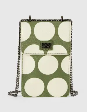 green cell phone holder with white polka dots