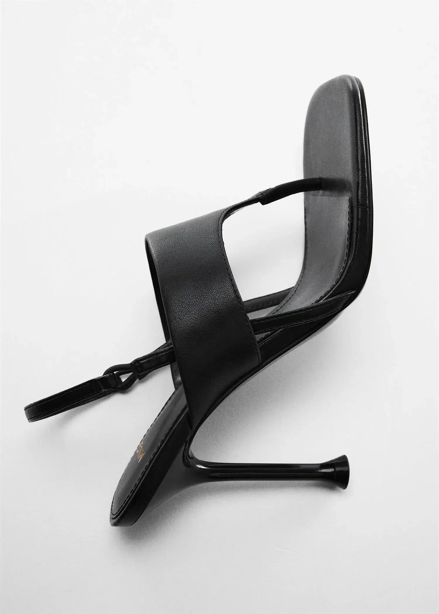 Mango Heeled leather sandals with straps. a pair of high heeled shoes sitting on top of each other. 