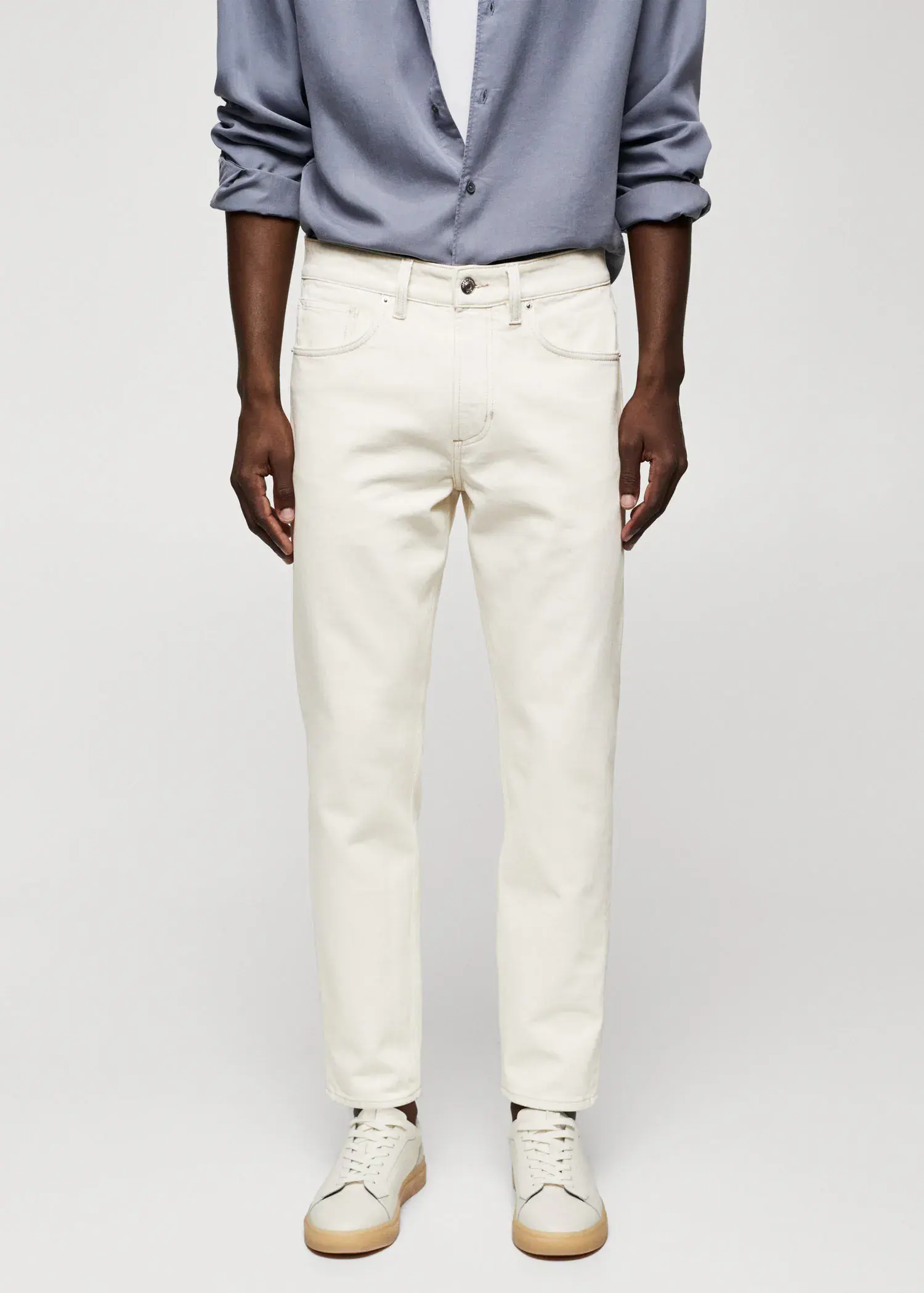 Mango Ben tapered cropped jeans. a person wearing white pants and a blue shirt. 