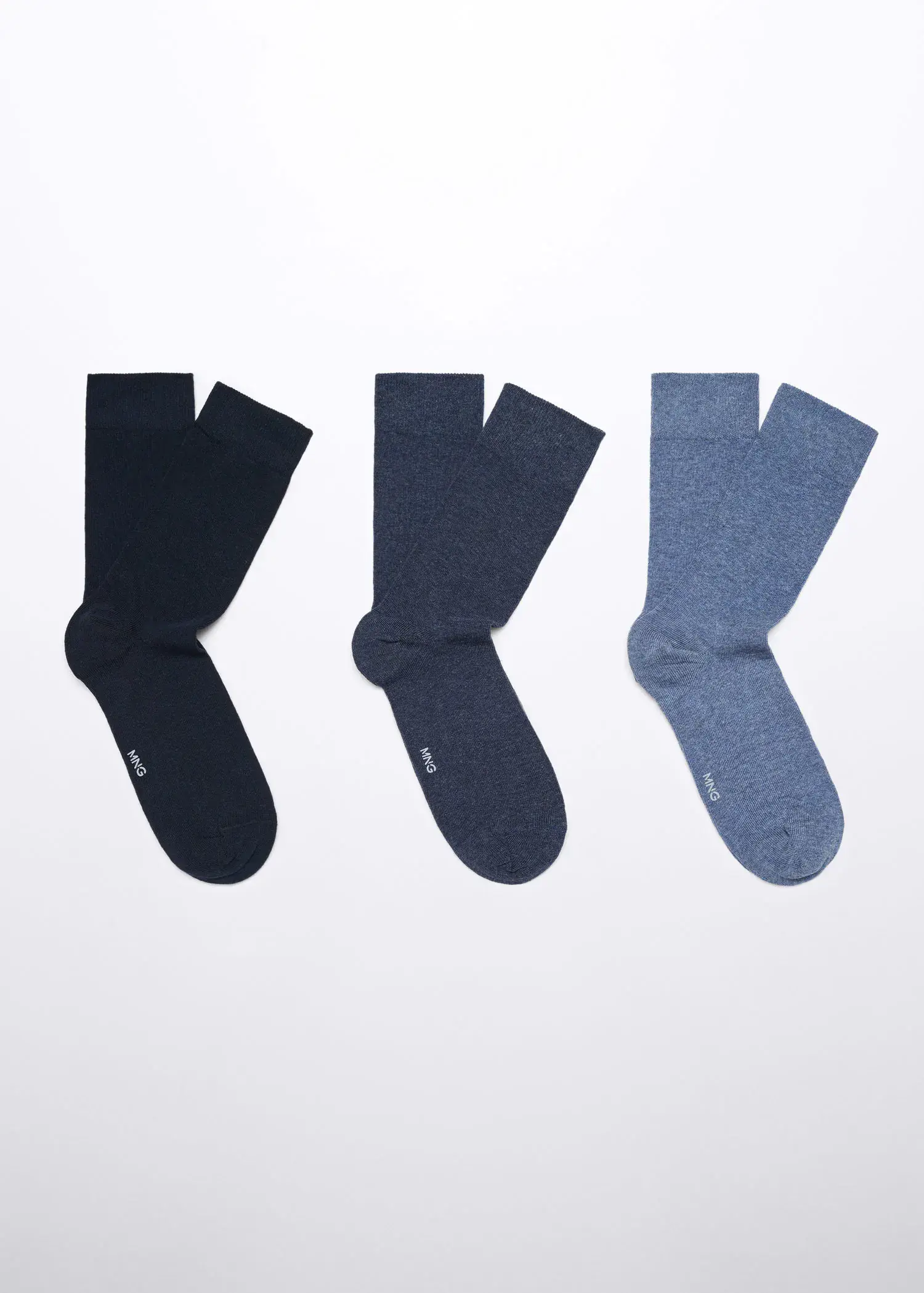 Mango Pack of 3 cotton socks. three pairs of socks are hanging on a wall. 