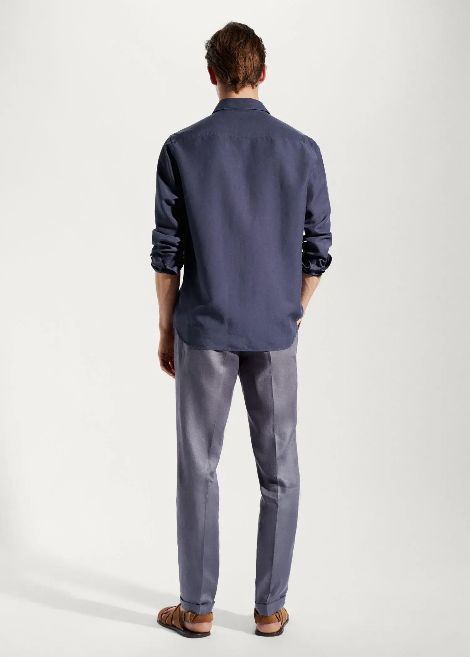 Mango Light tencel-linen shirt. a man wearing a blue shirt and gray pants. 