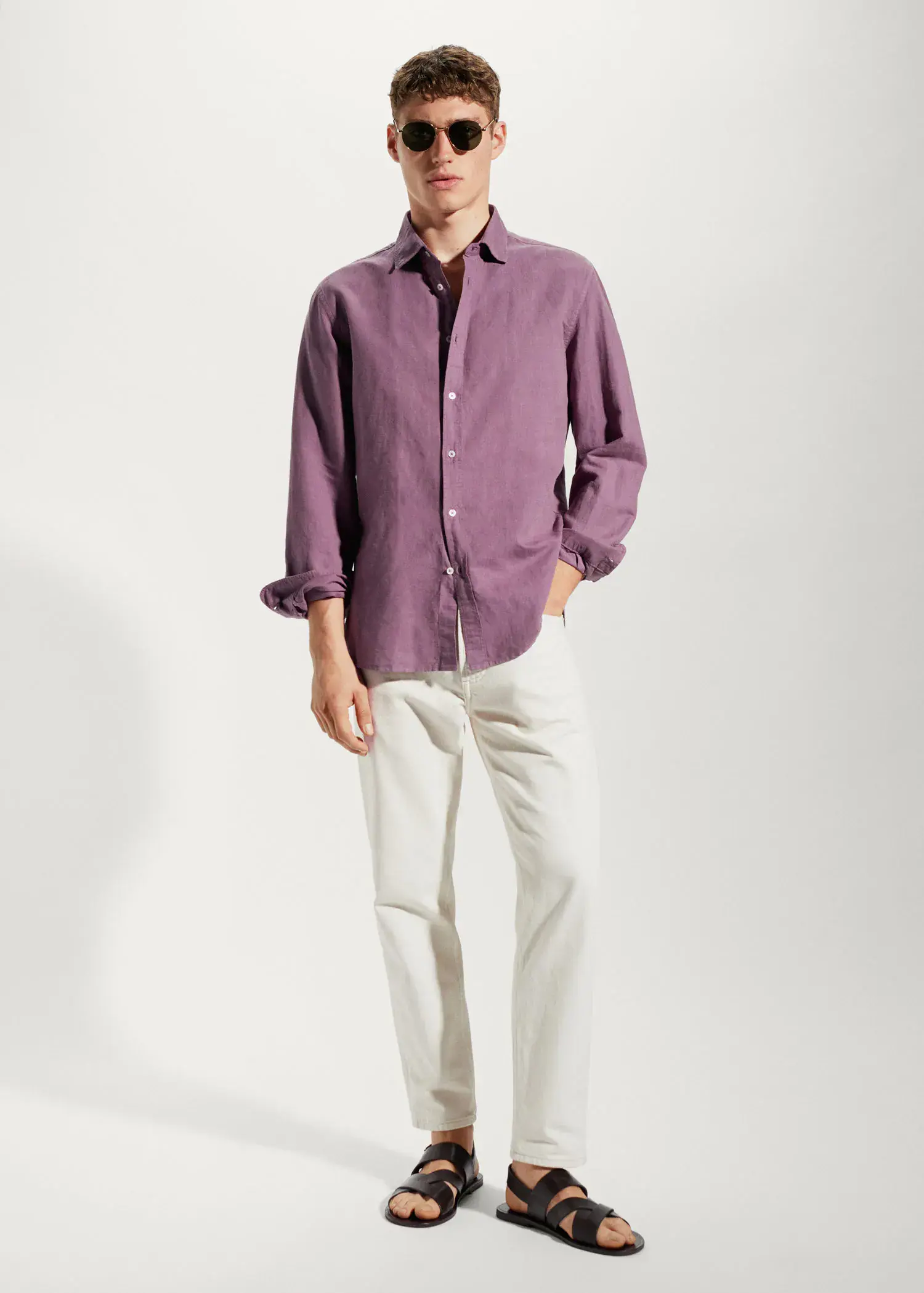 Mango Regular-fit linen cotton shirt. a man wearing a purple shirt and white pants. 