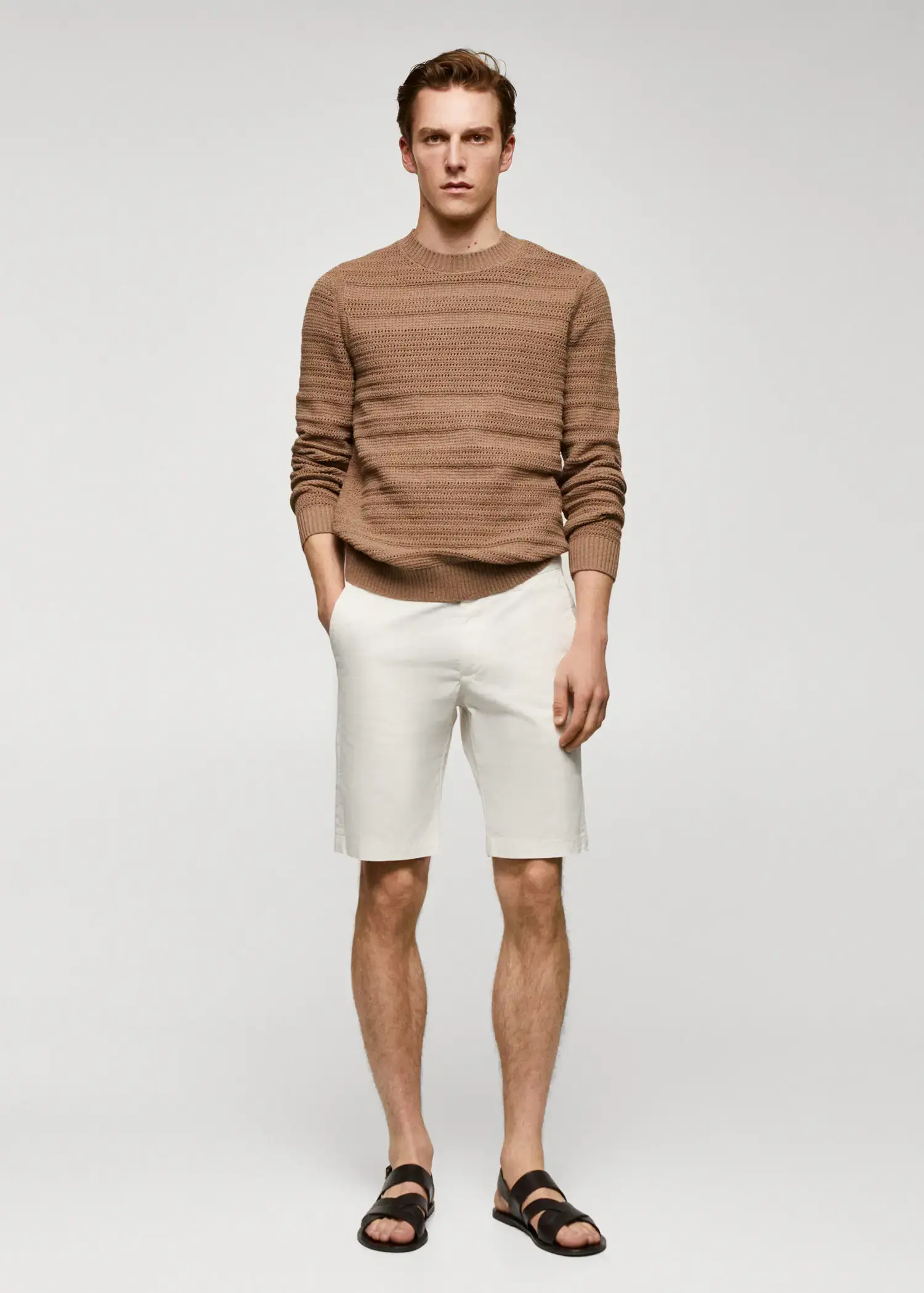 Mango Chino Bermuda shorts. a man in a tan sweater and white shorts. 