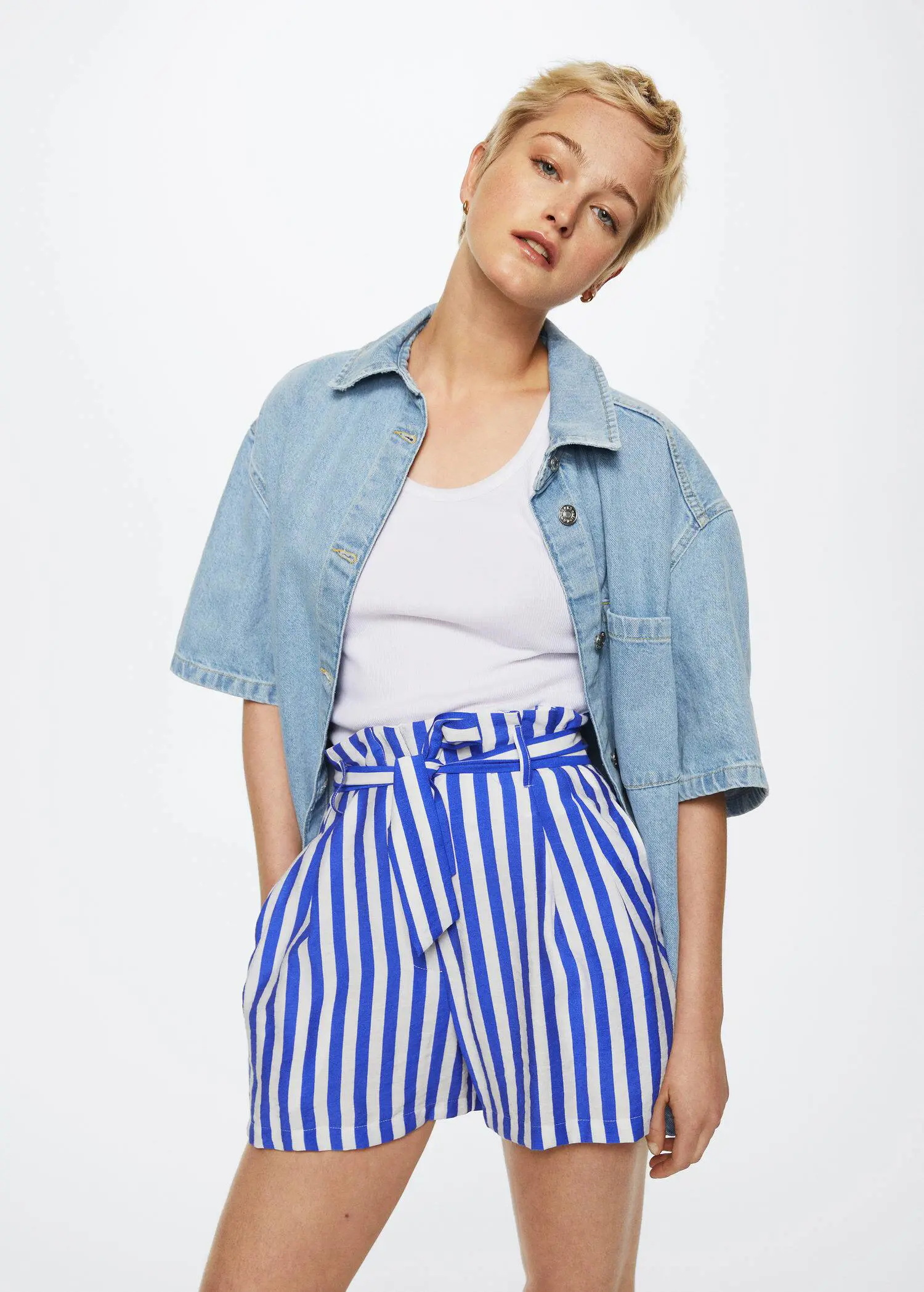 Mango Paperbag printed shorts. a woman wearing a blue and white striped outfit. 