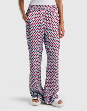 light blue trousers with apple pattern