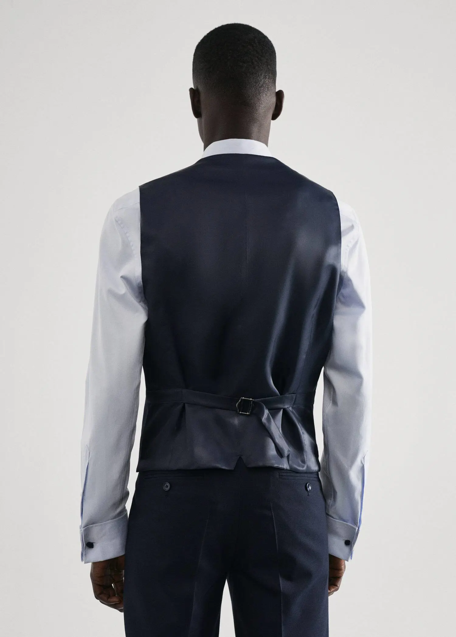 Mango Slim-fit suit vest. a man wearing a suit and a vest. 