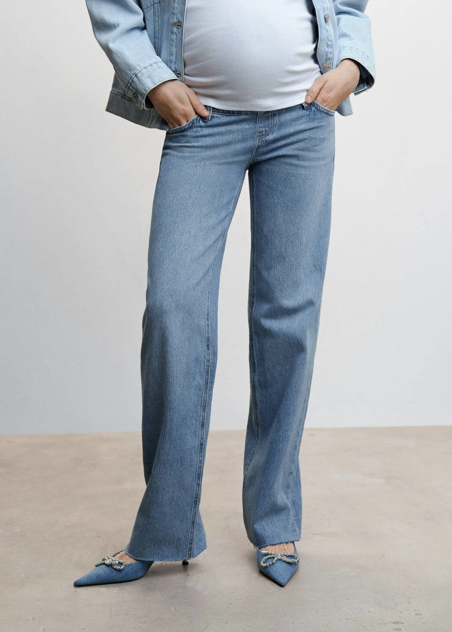 Mango Maternity wideleg jeans. a woman wearing a pair of blue jeans. 