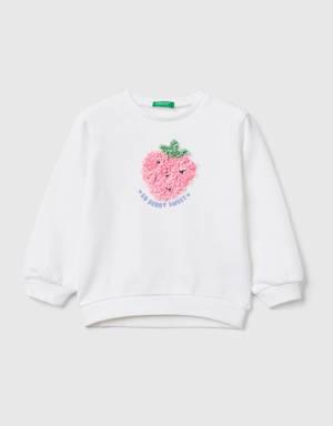 sweatshirt with petal look applique