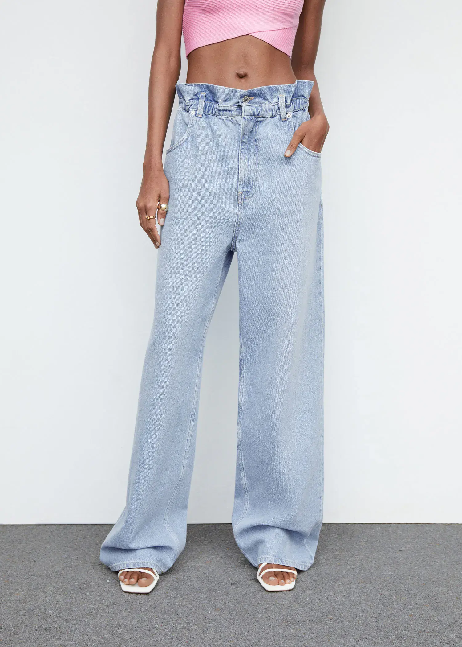 Mango Waist straight Slouchy jeans. a person standing in front of a white wall. 