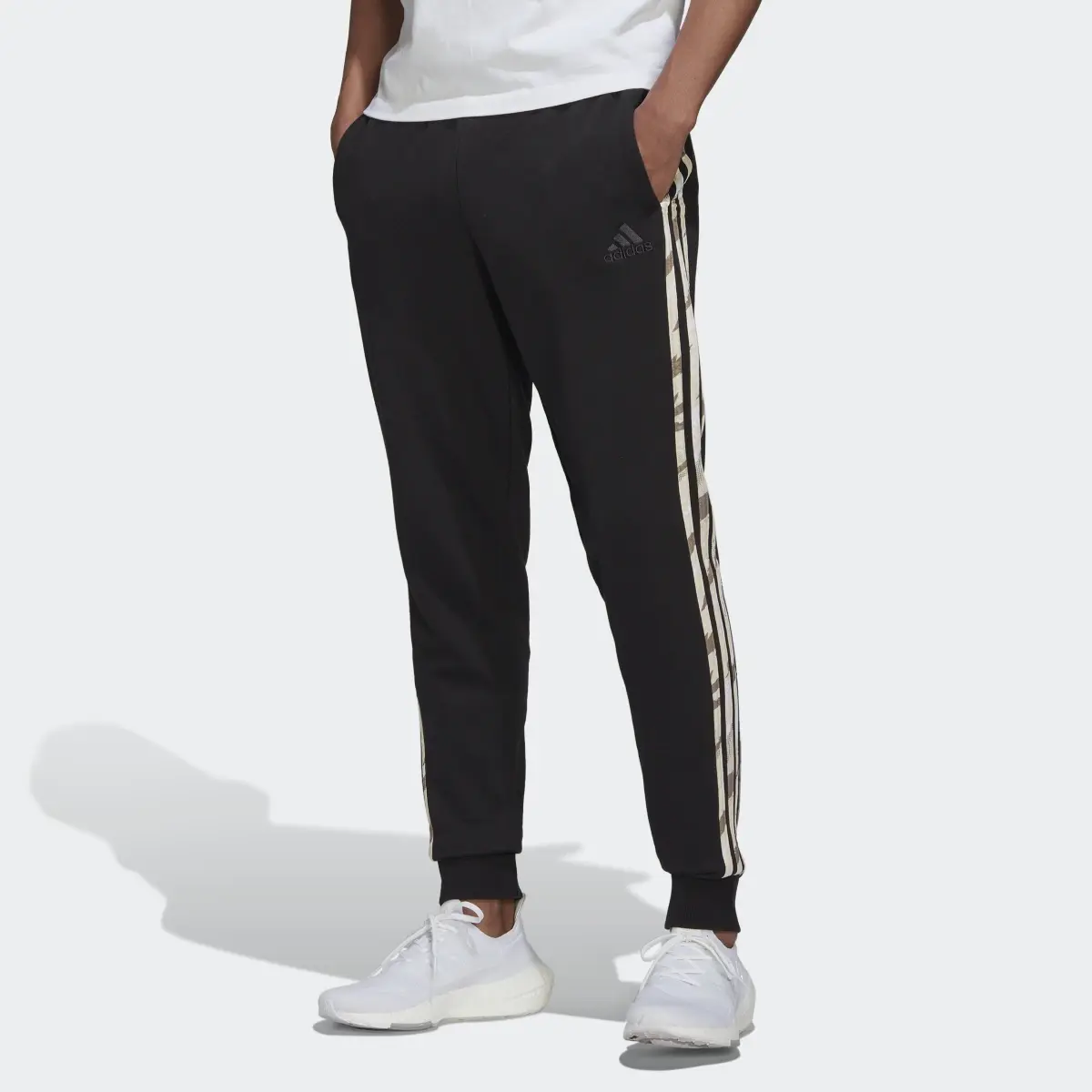 Adidas Essentials French Terry Camo Print Pants. 1