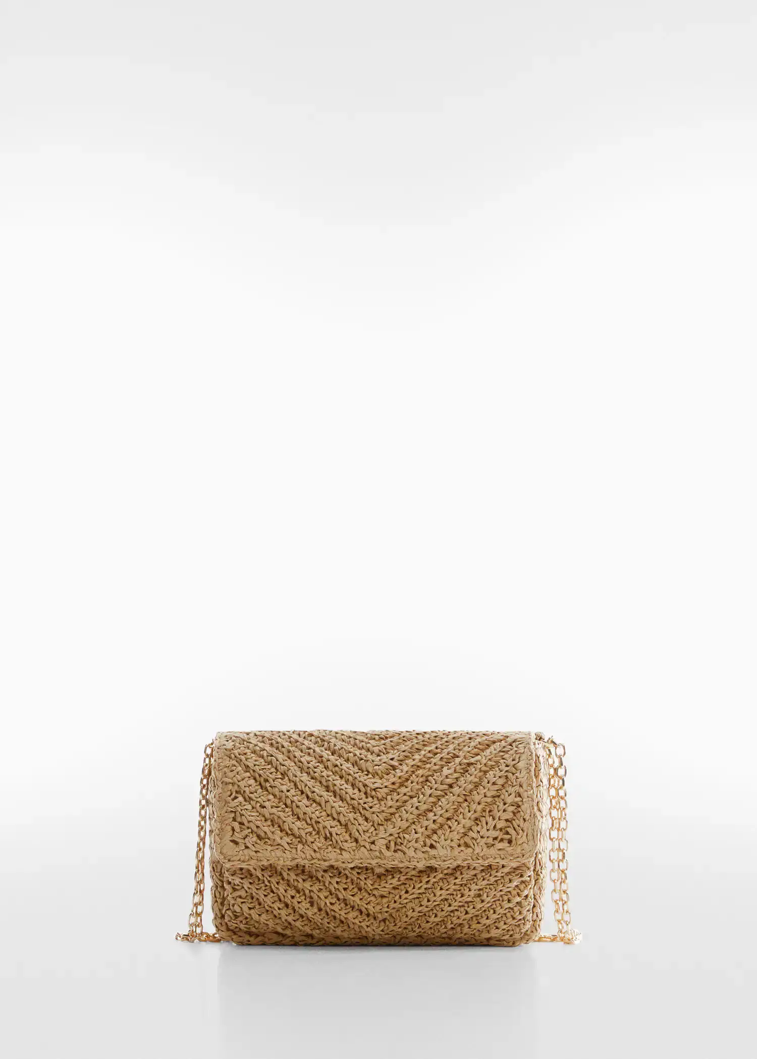 Mango Natural fibre bag with flap. a tan purse sitting on top of a white table. 