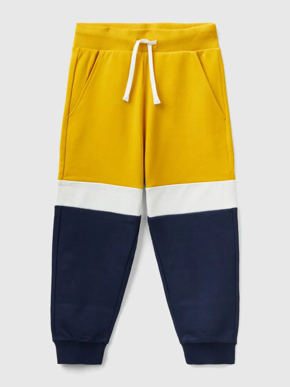 Benetton yellow ochre and dark blue joggers. 1