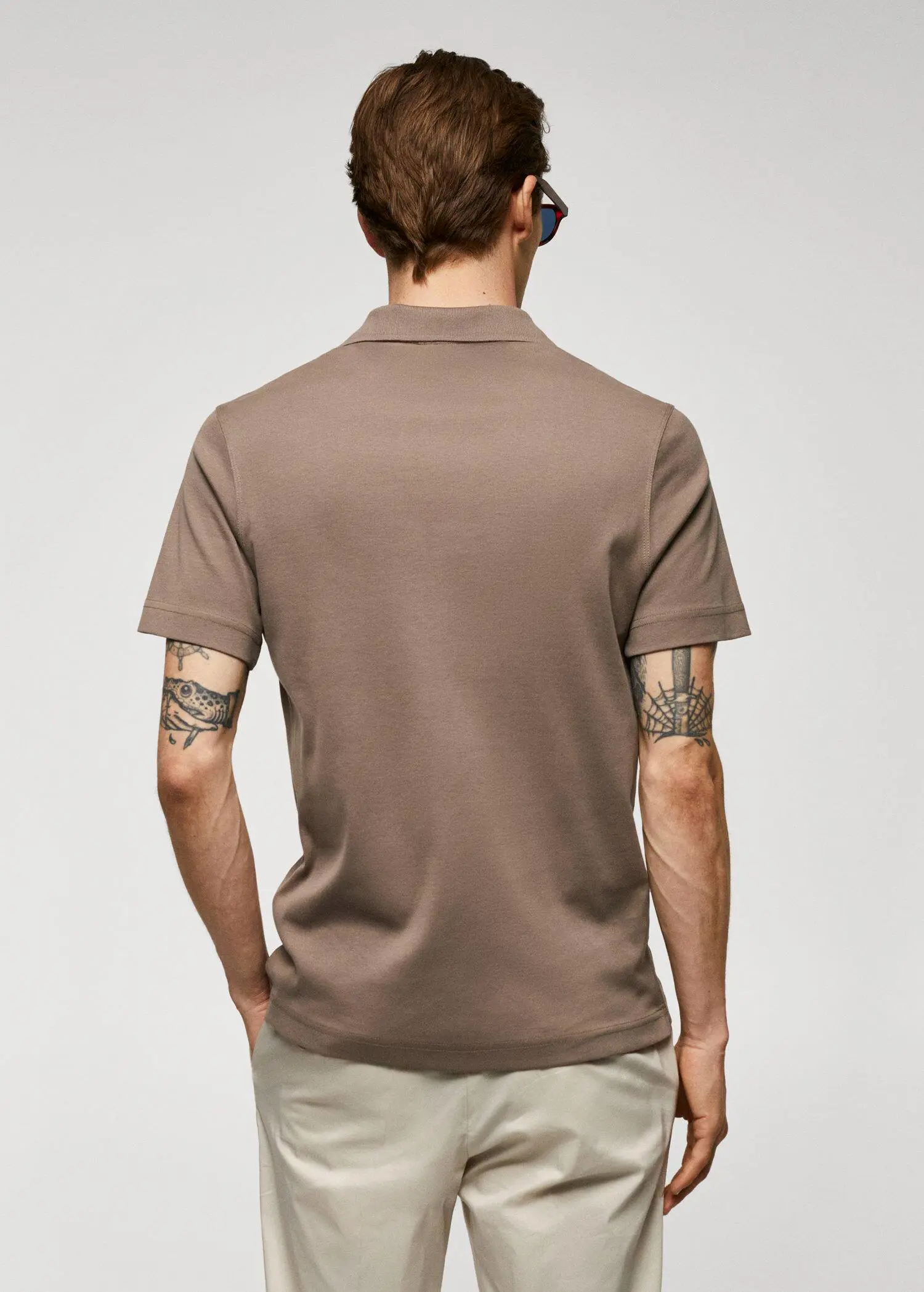 Mango 100% cotton polo shirt with pocket. a man with tattoos on his arms wearing a brown polo shirt. 