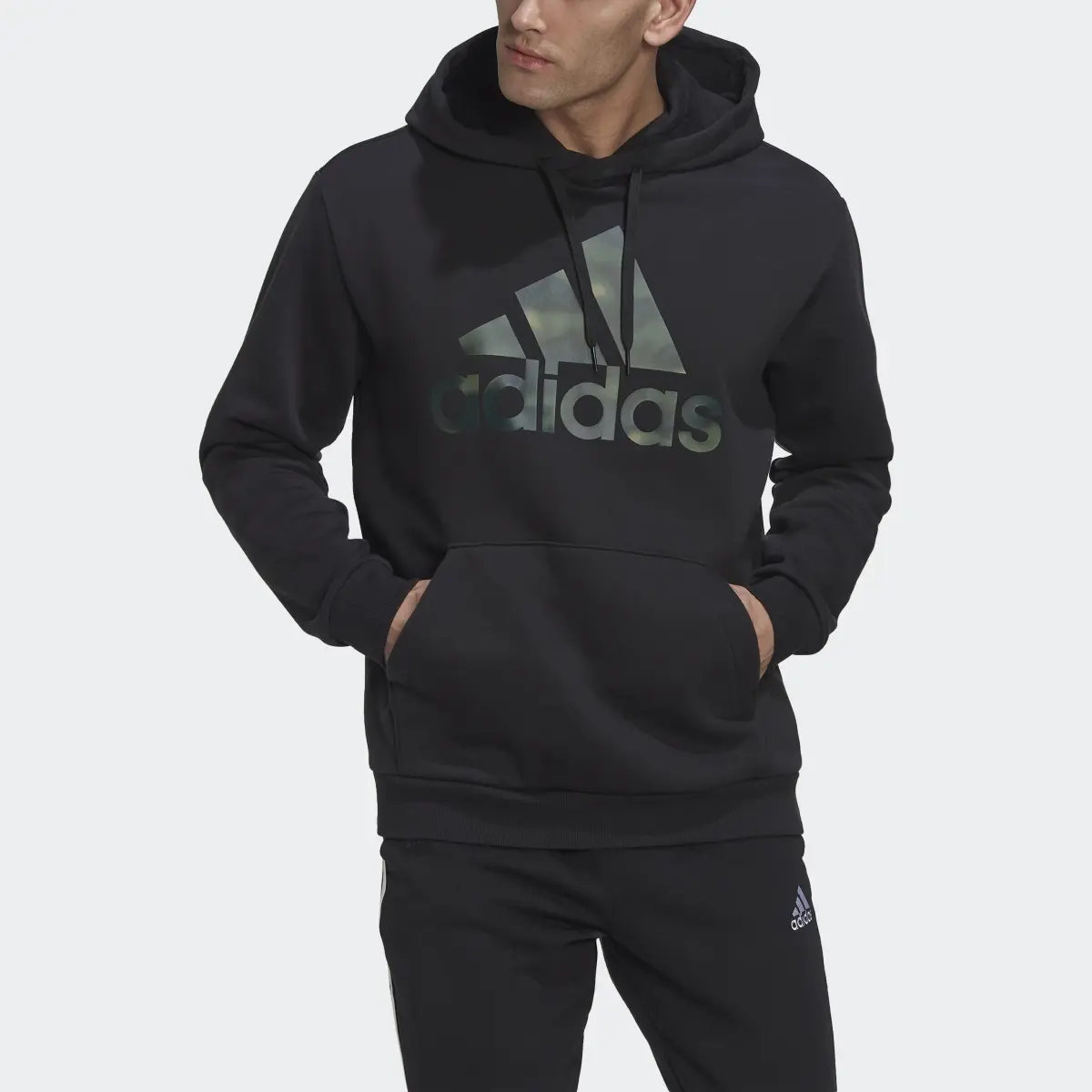 Adidas Essentials Camo Print French Terry Hoodie. 1