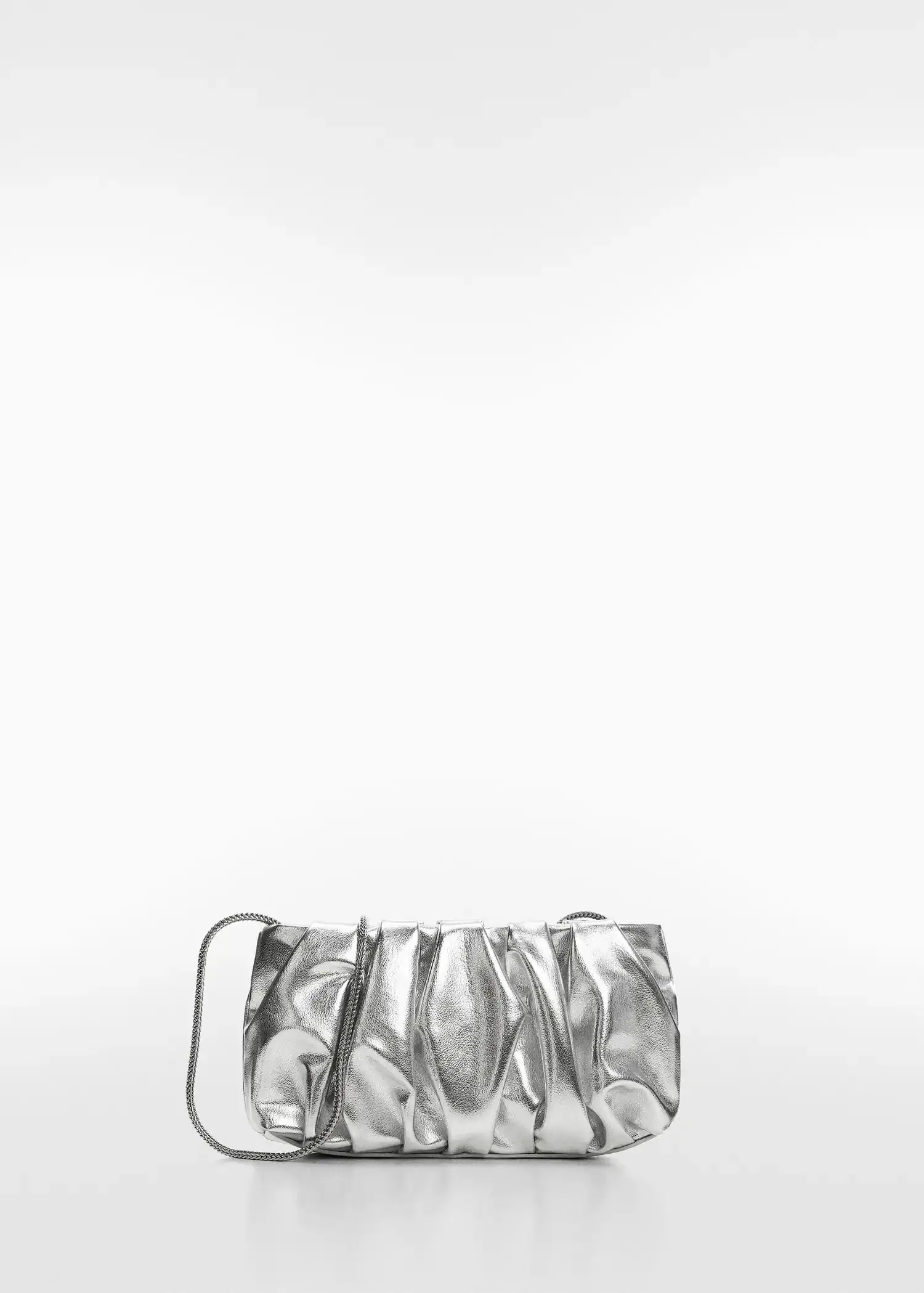 Mango Quilted chain bag. a silver purse sitting on top of a white table. 