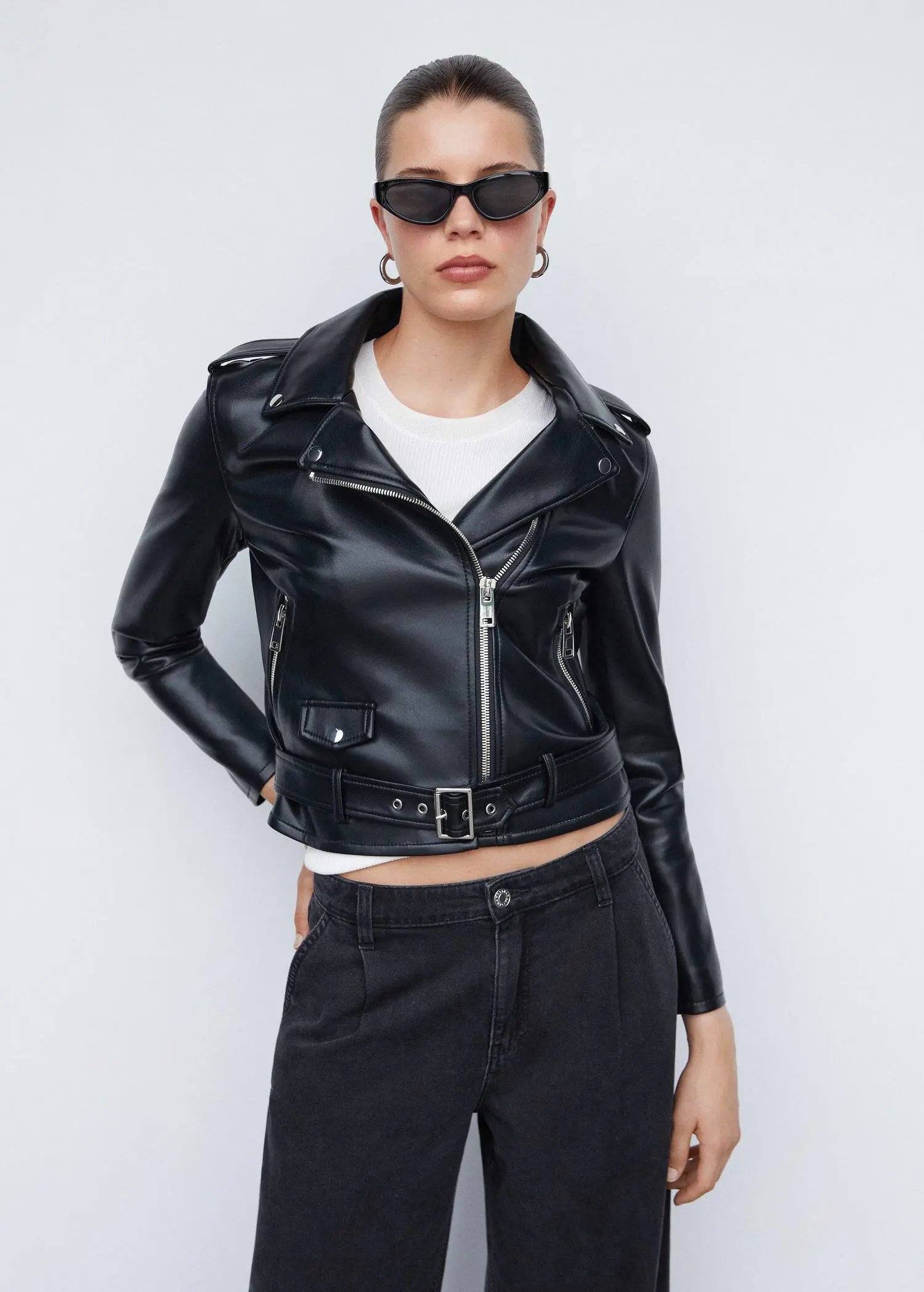 Mango Faux-leather biker jacket. a woman wearing a black leather jacket and sunglasses. 