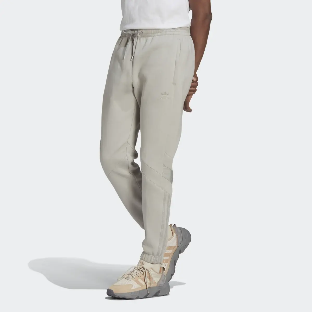 Adidas Pantalon de survêtement slim adidas Rekive. 1