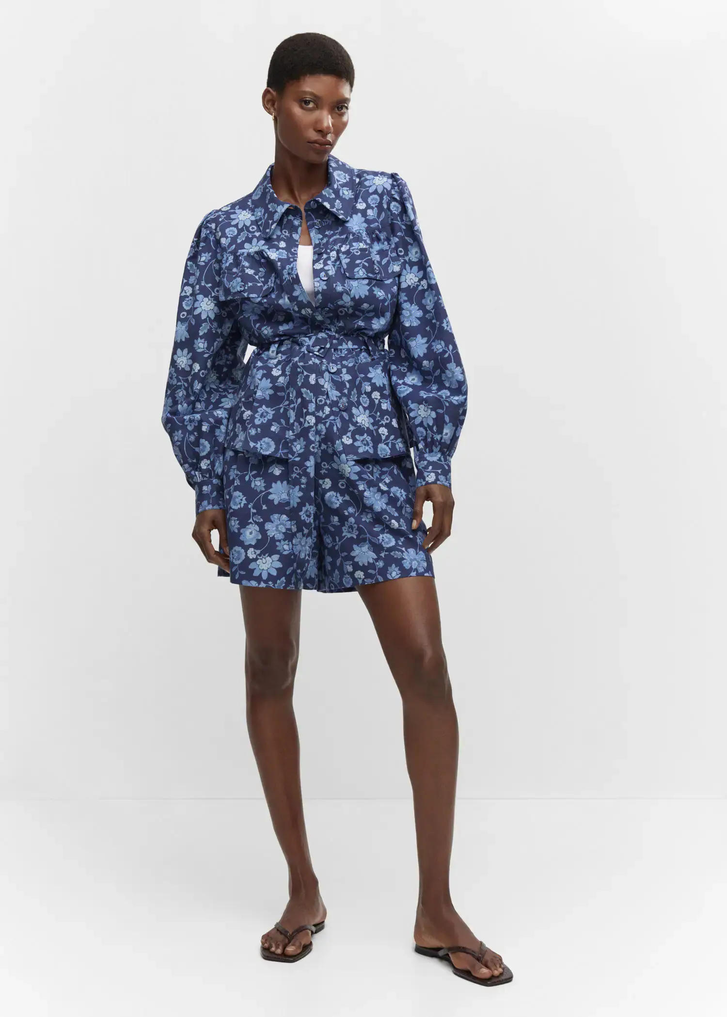 Mango Floral-print shorts. a woman in a blue floral print outfit. 