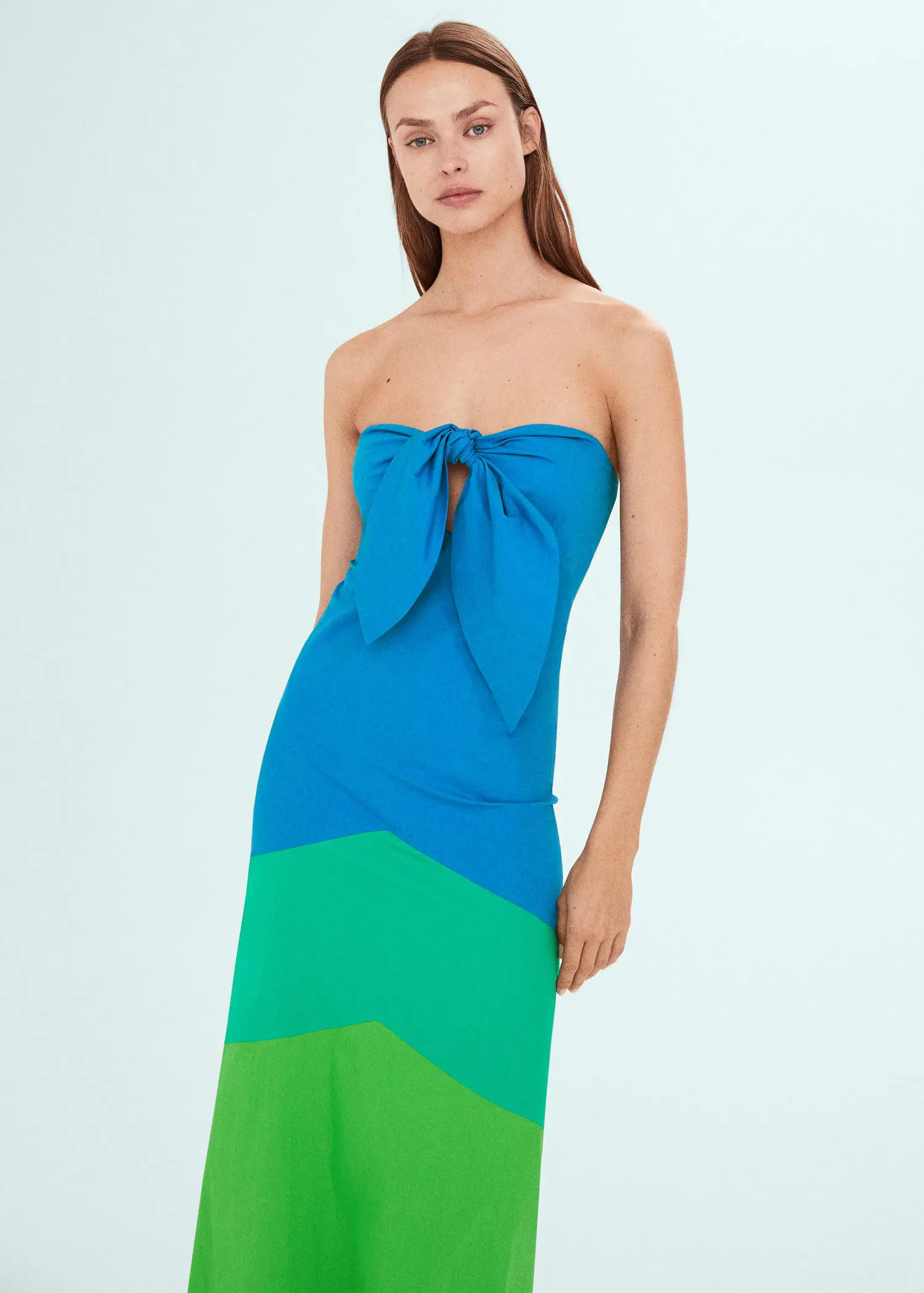 Mango Multi-colored dress with knot neckline. a woman wearing a blue and green dress. 