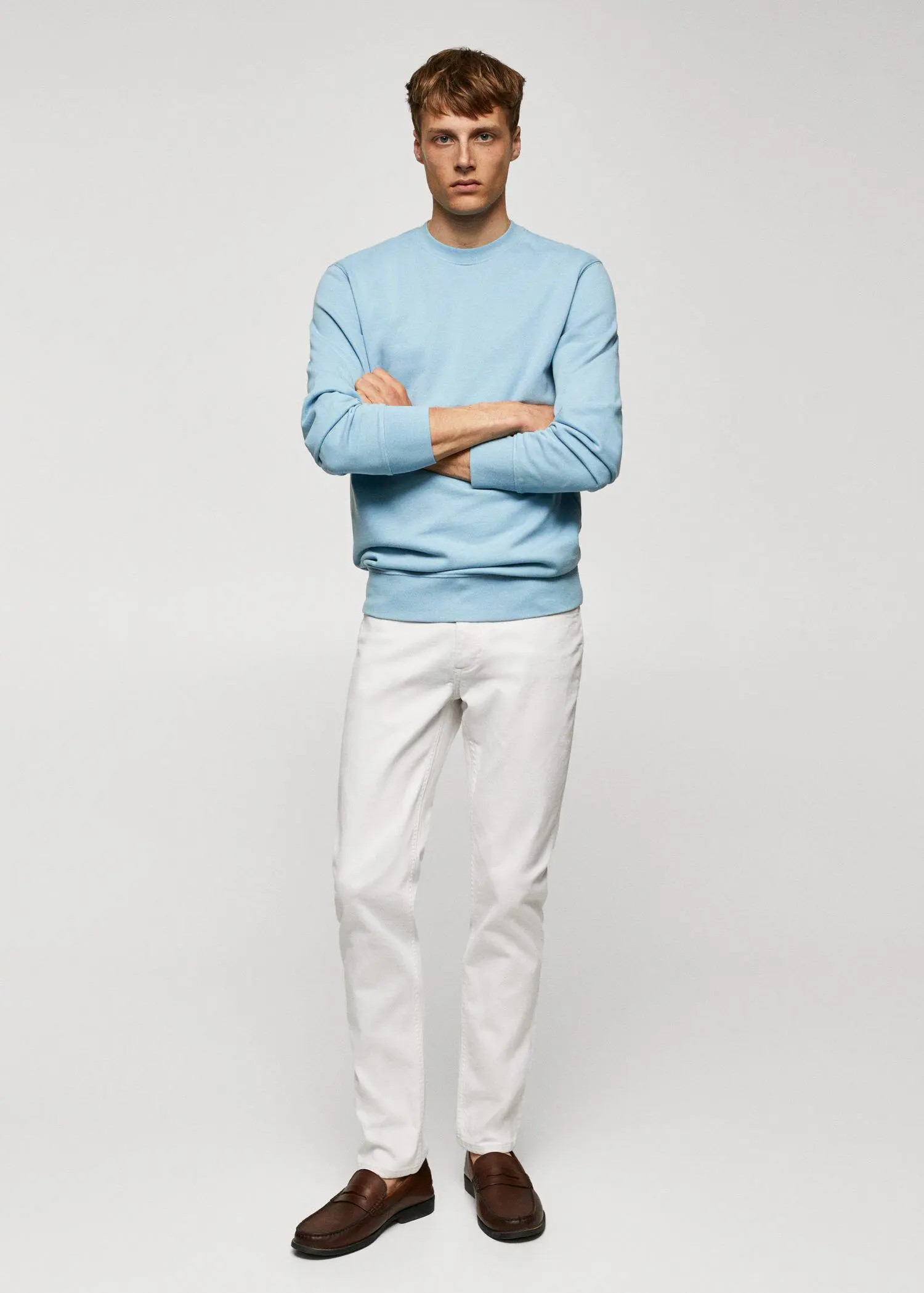 Mango 100% cotton basic sweatshirt . a man standing with his arms crossed wearing white pants. 