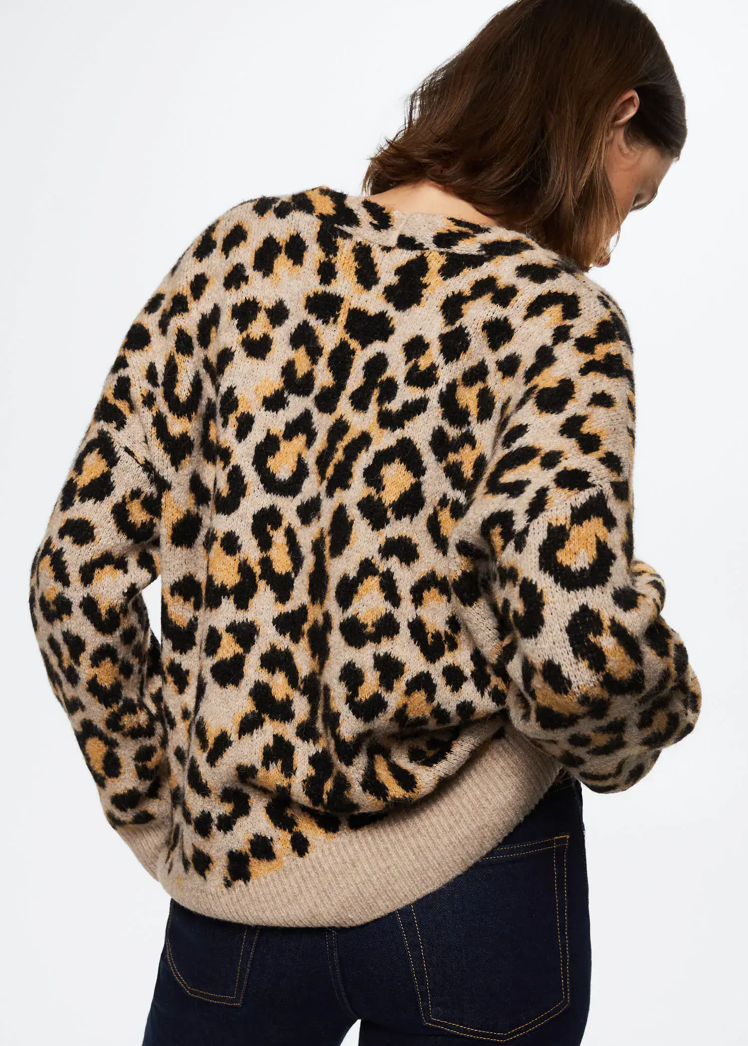 Mango Animal print cardigan. a person wearing a leopard print sweater. 