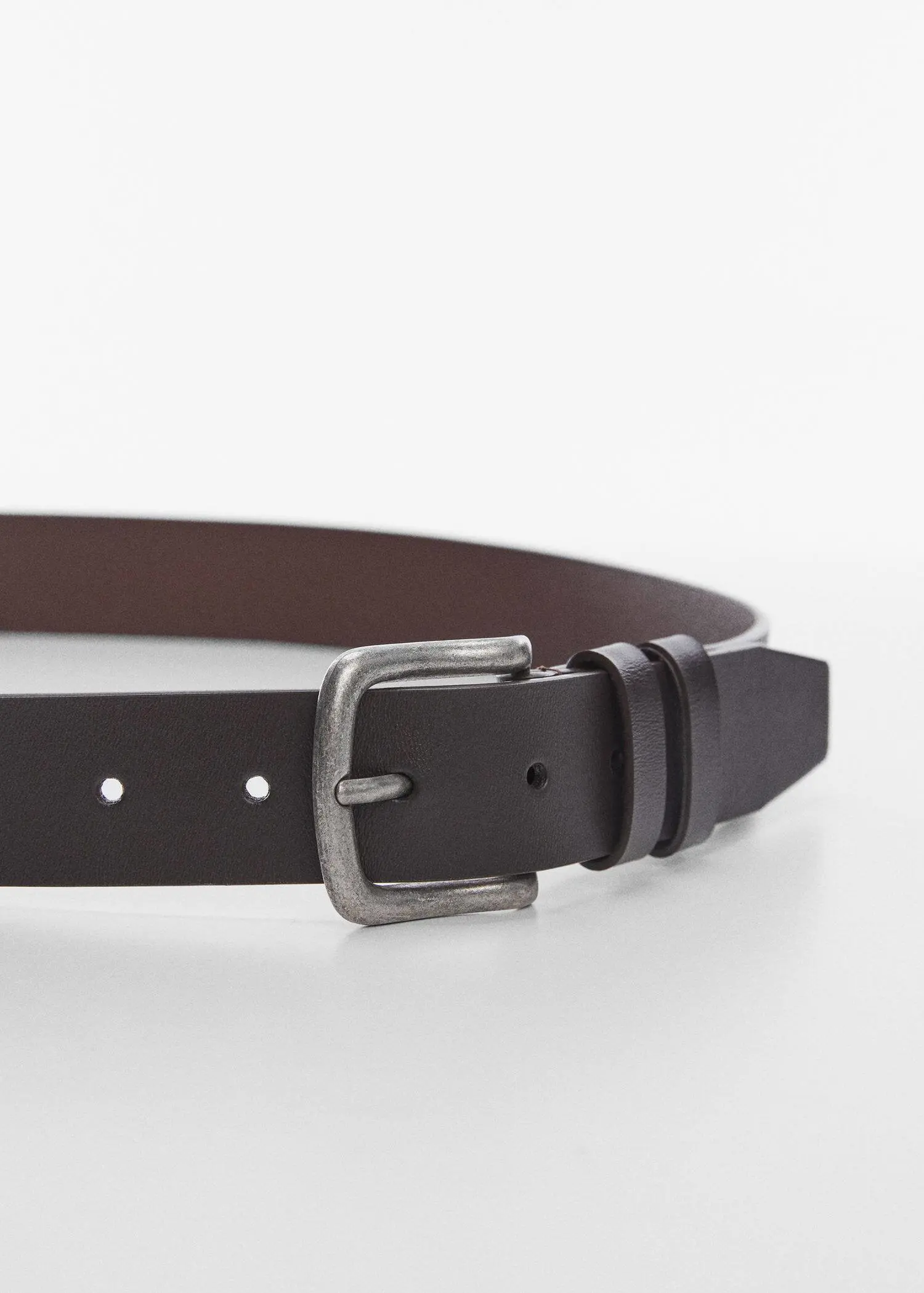 Mango Buckle leather belt. a close-up of a black leather belt with a silver buckle. 