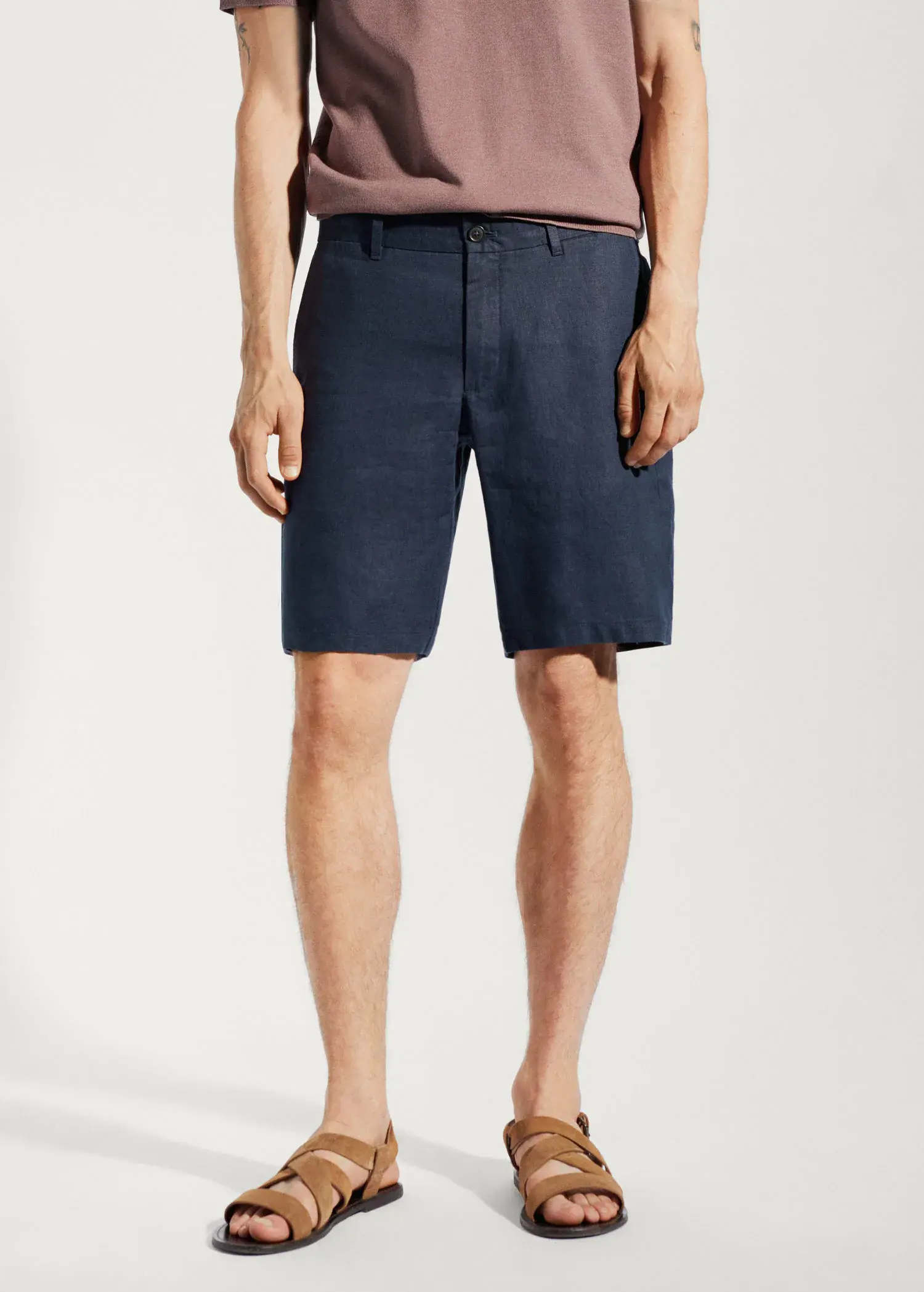 Mango 100% linen shorts. a man wearing a pair of blue shorts. 